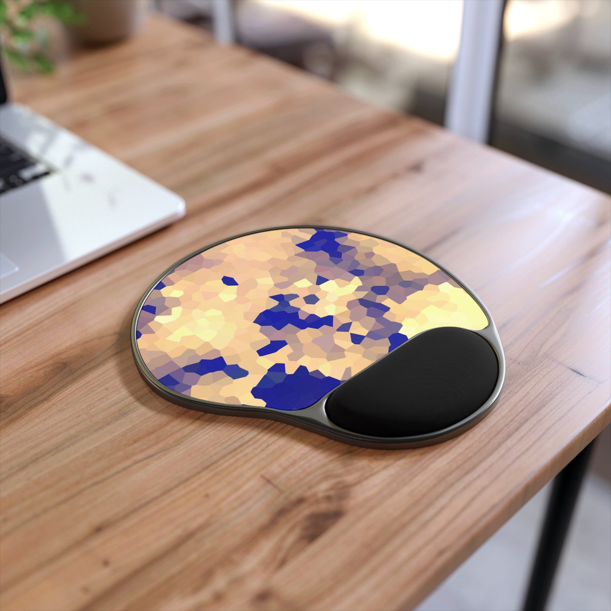 Mouse pad with wrist support on a wooden desk