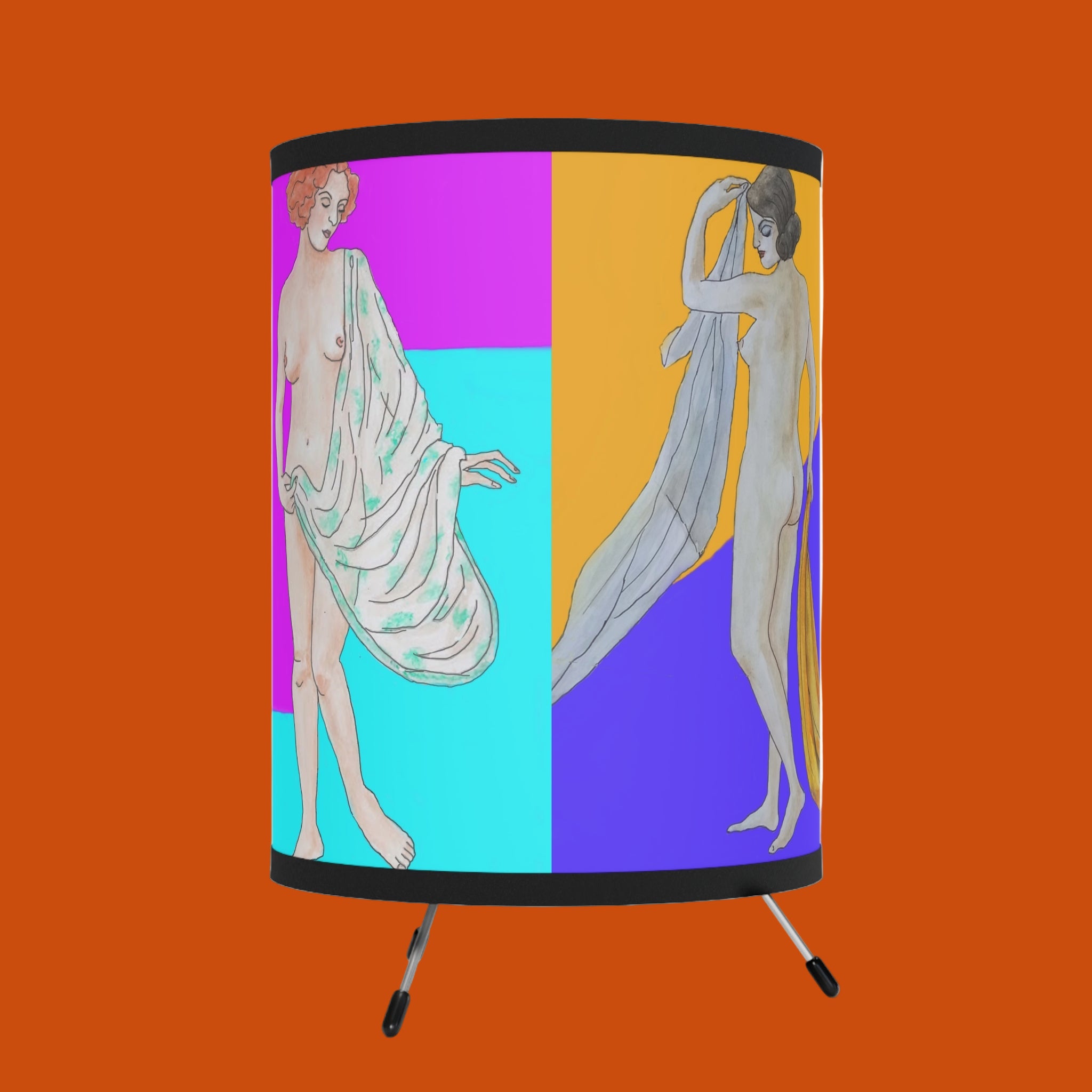 Table lamp with artistic design of two nude figures on a colorful background