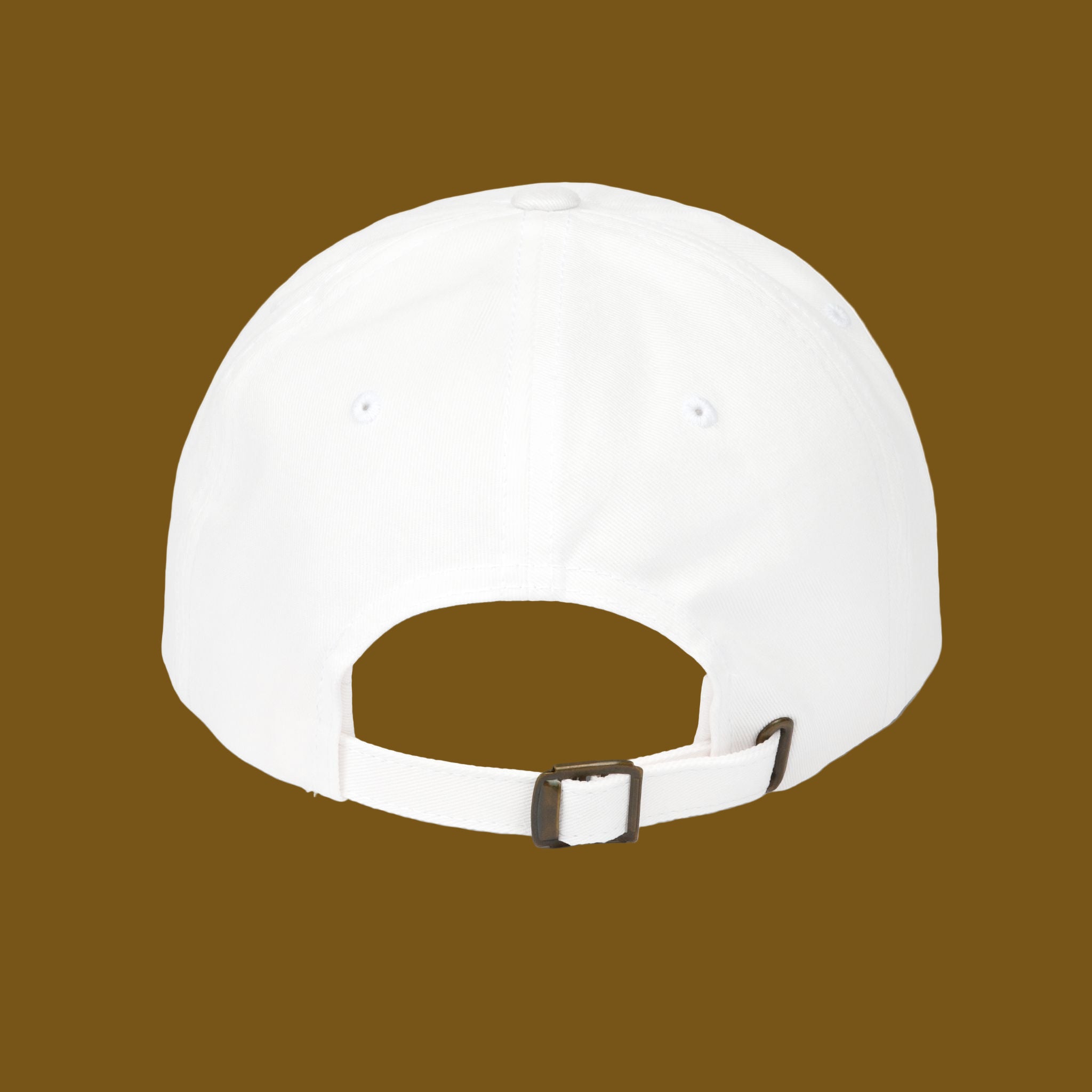 White baseball cap with a brown buckle on a brown background