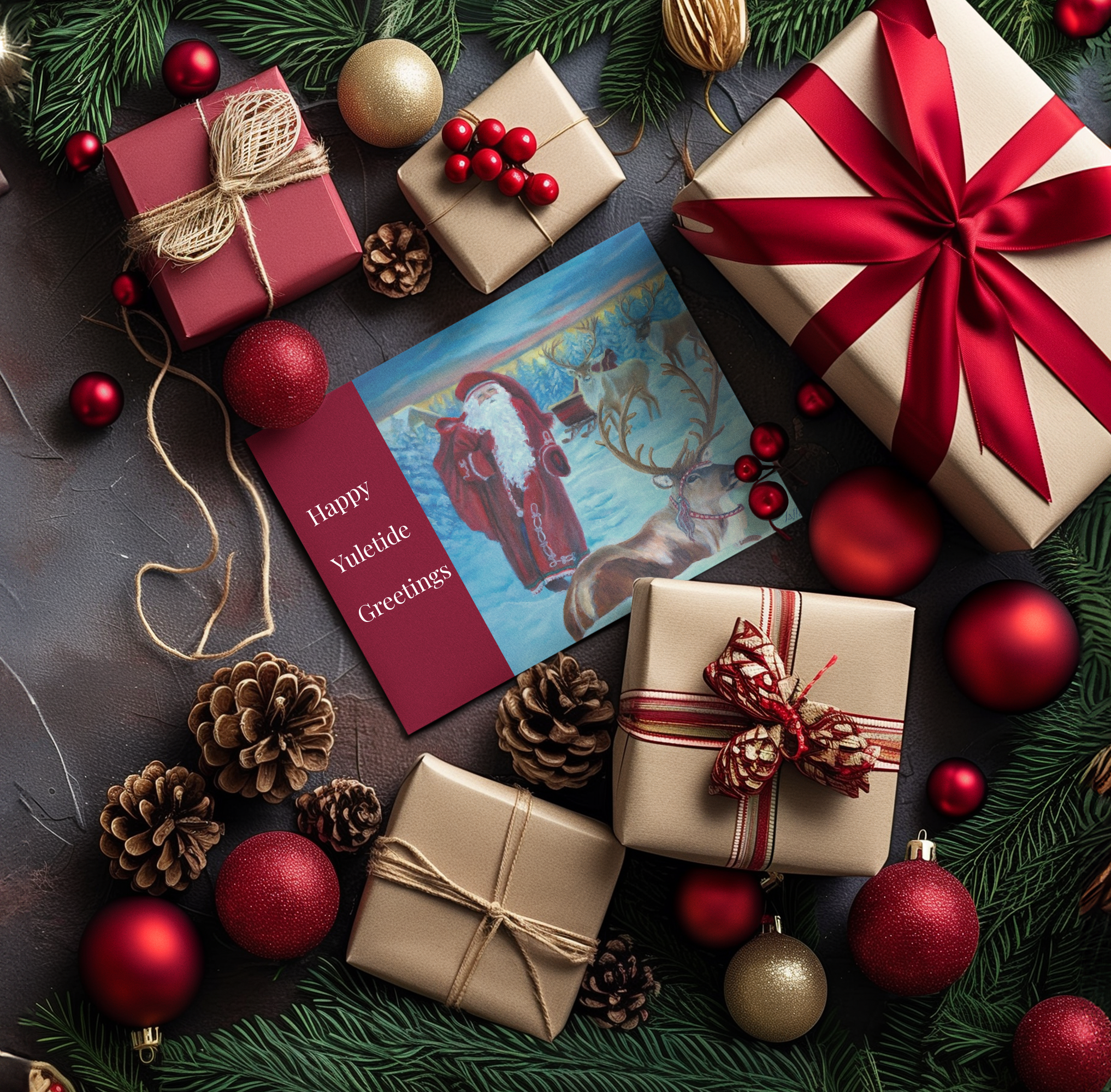 Christmas-themed gift arrangement with presents, ornaments, and a greeting card on a dark surface.