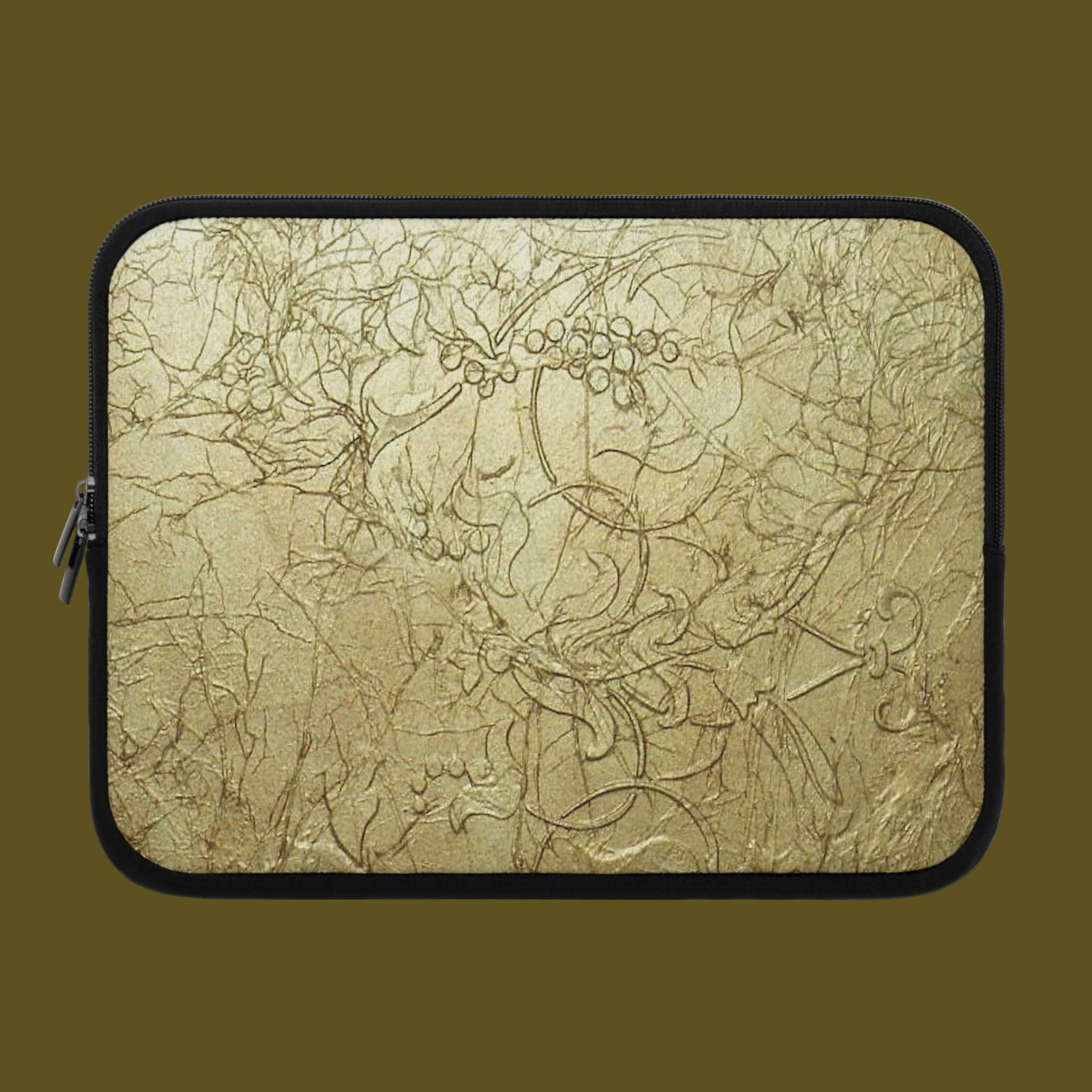 Laptop sleeve with intricate gold beige design on a white background