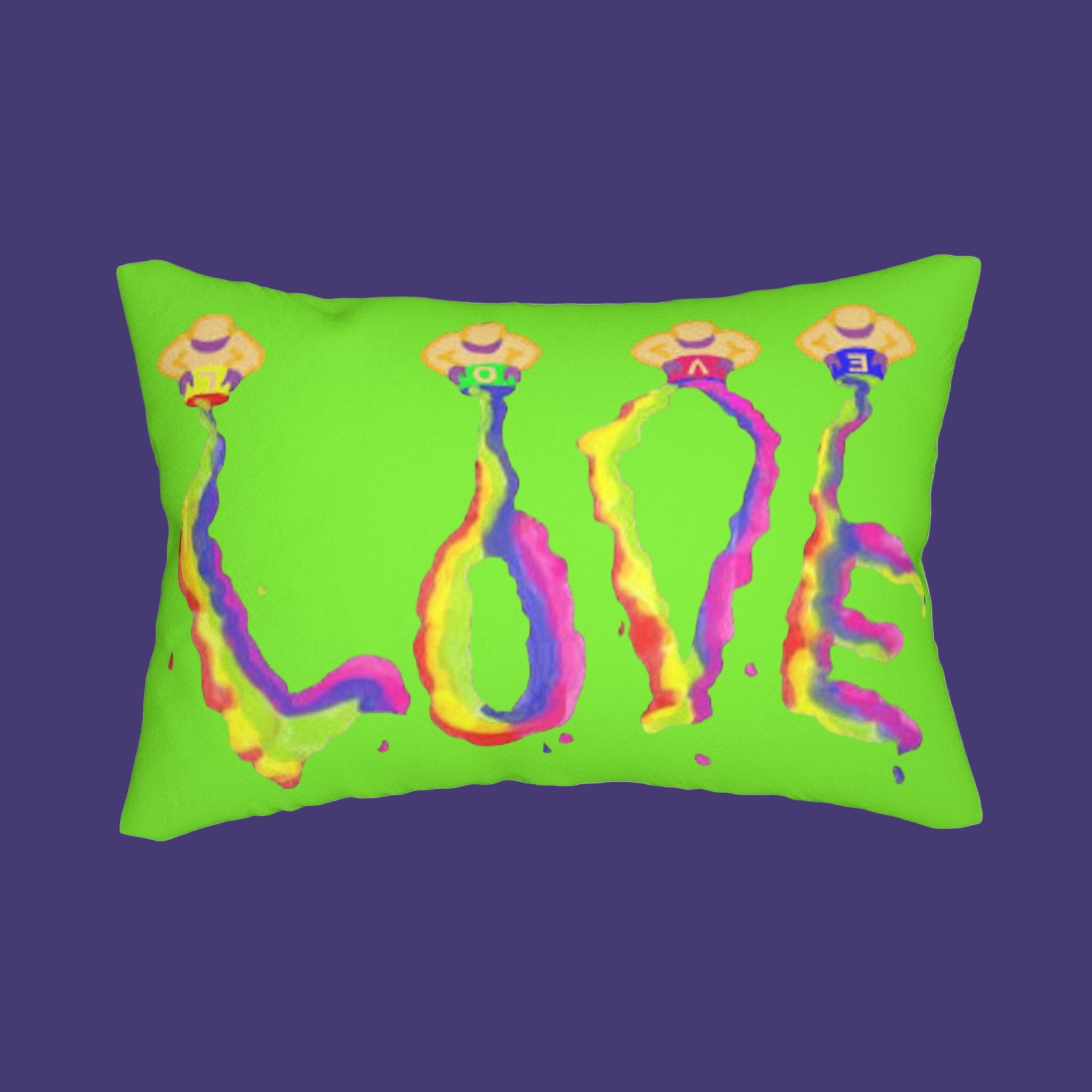 Green pillow with colorful 'LOVE' design on a white background