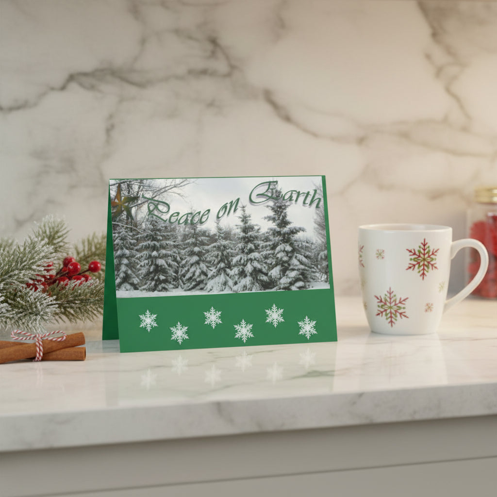 Christmas card with snowy trees and 'Peace on Earth' text