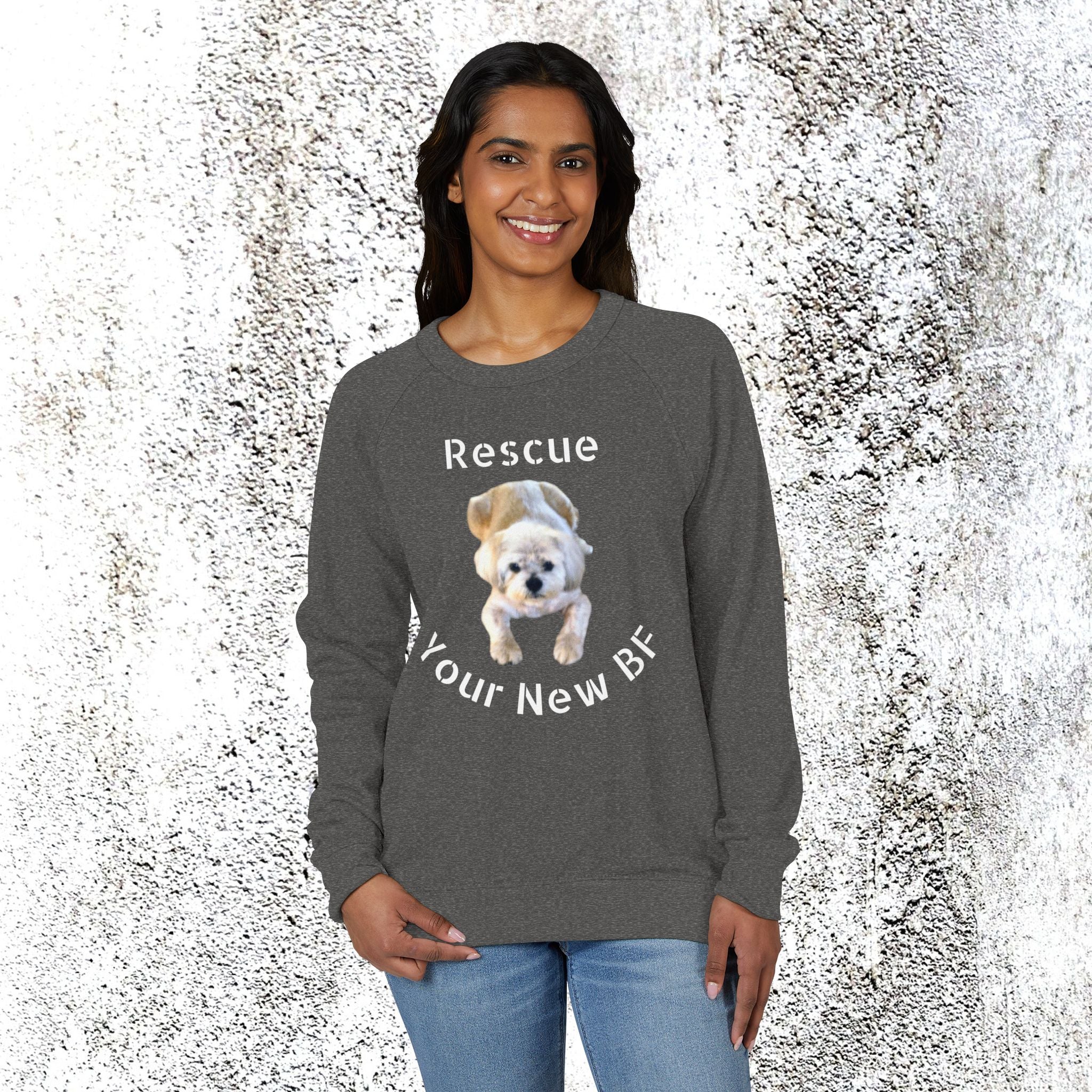 Woman wearing a gray sweatshirt with a dog graphic and text on a textured white background