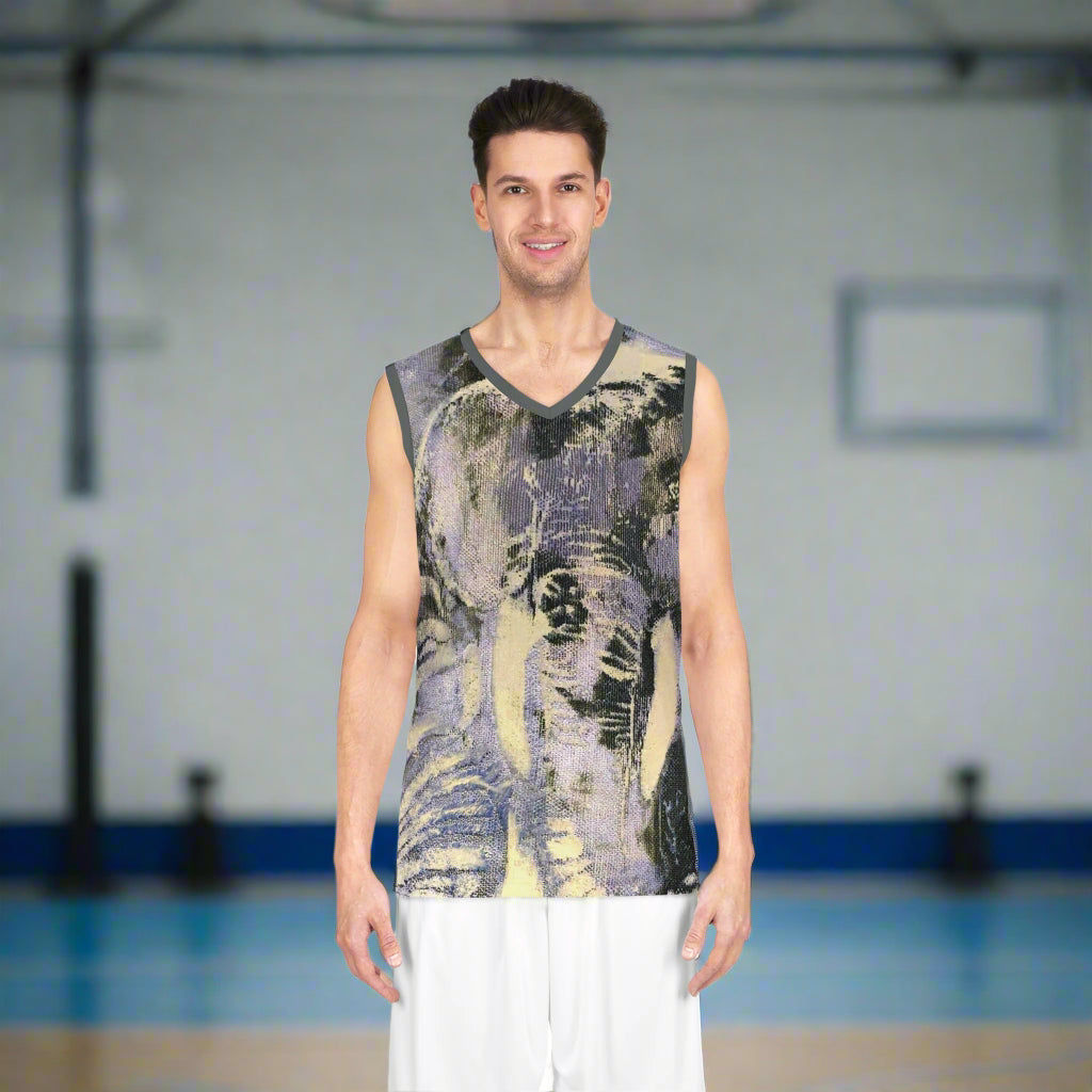 Man wearing a sleeveless, jungle patterned shirt on a basketball court background