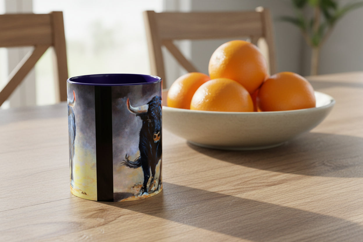 Mug with blue interior and handle shows both sides have artist painting of charging bull