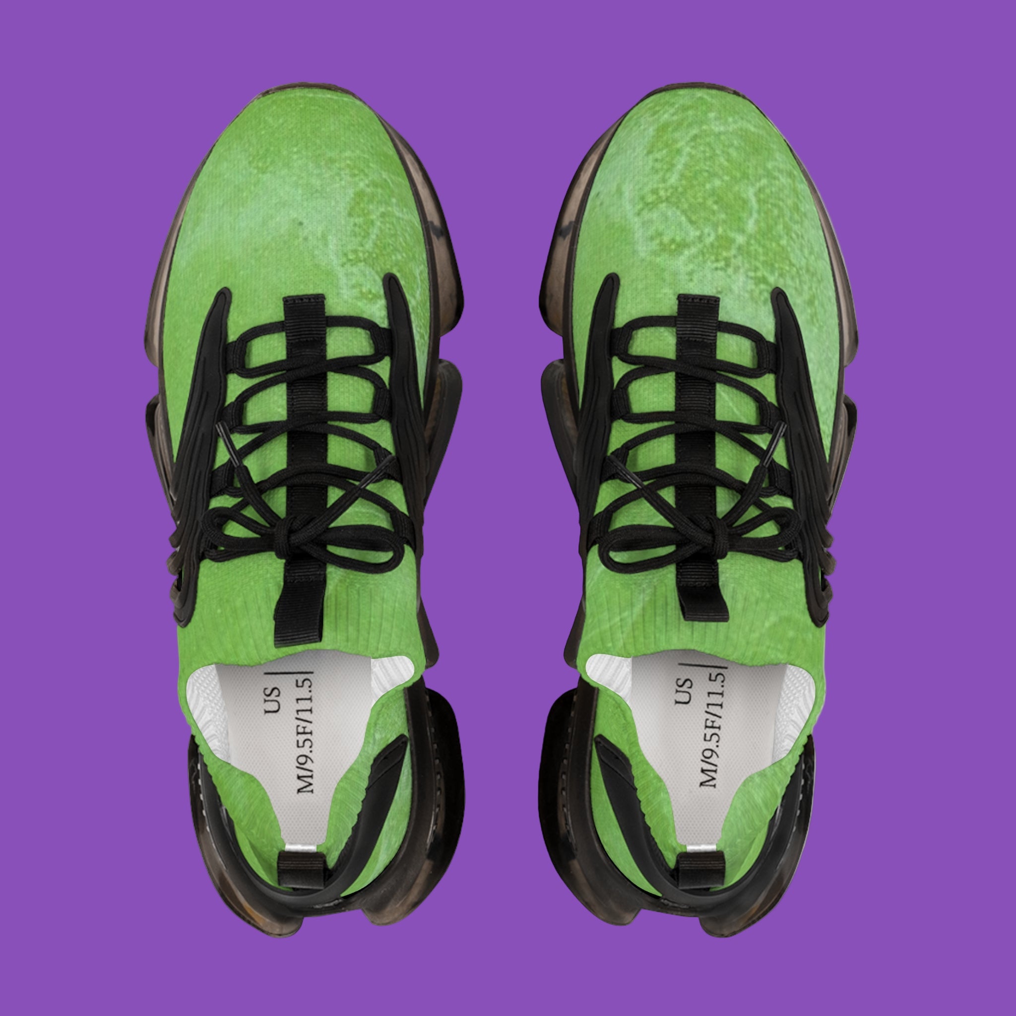 Green sneakers with black laces on a purple background