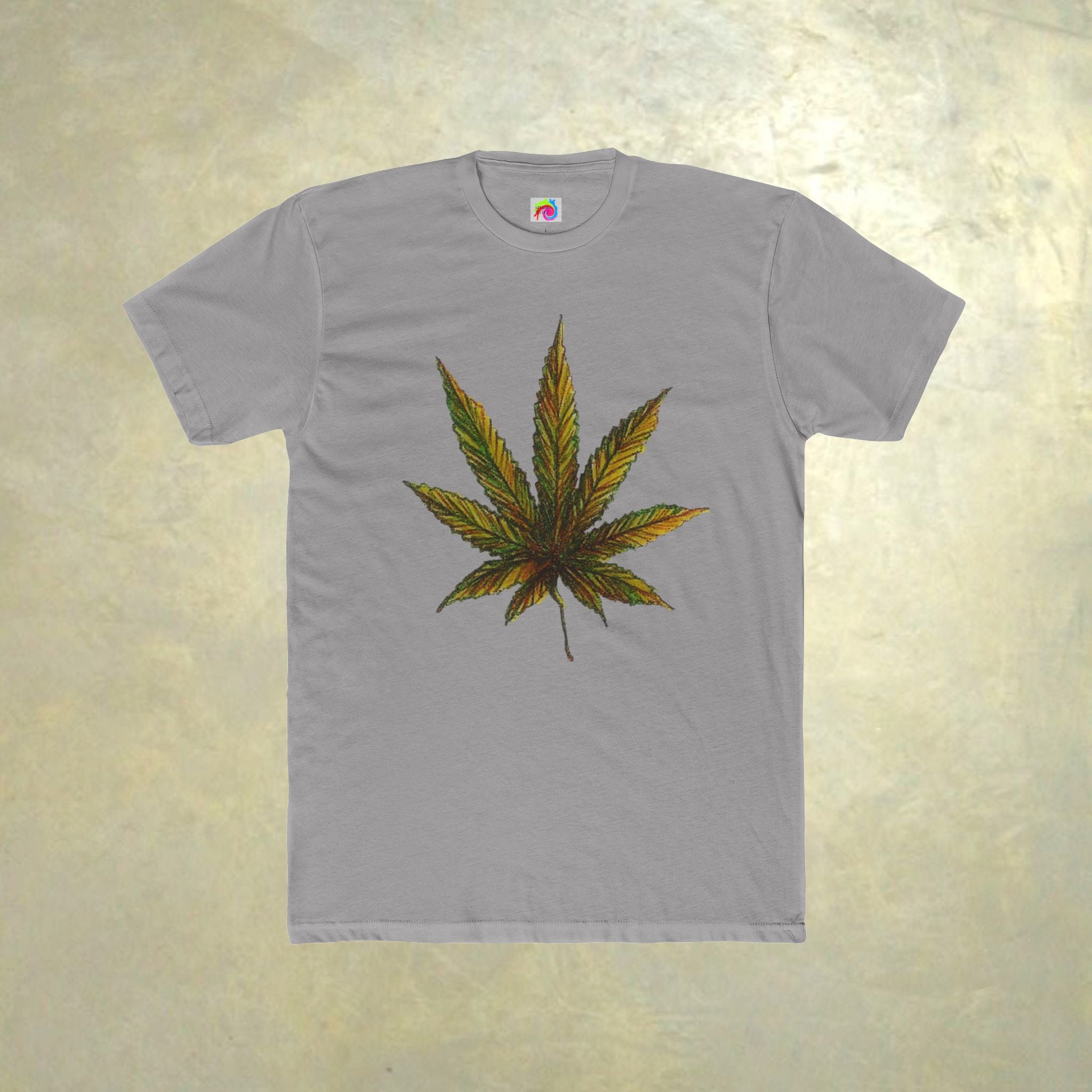Gray t-shirt with a cannabis leaf design on a textured beige background