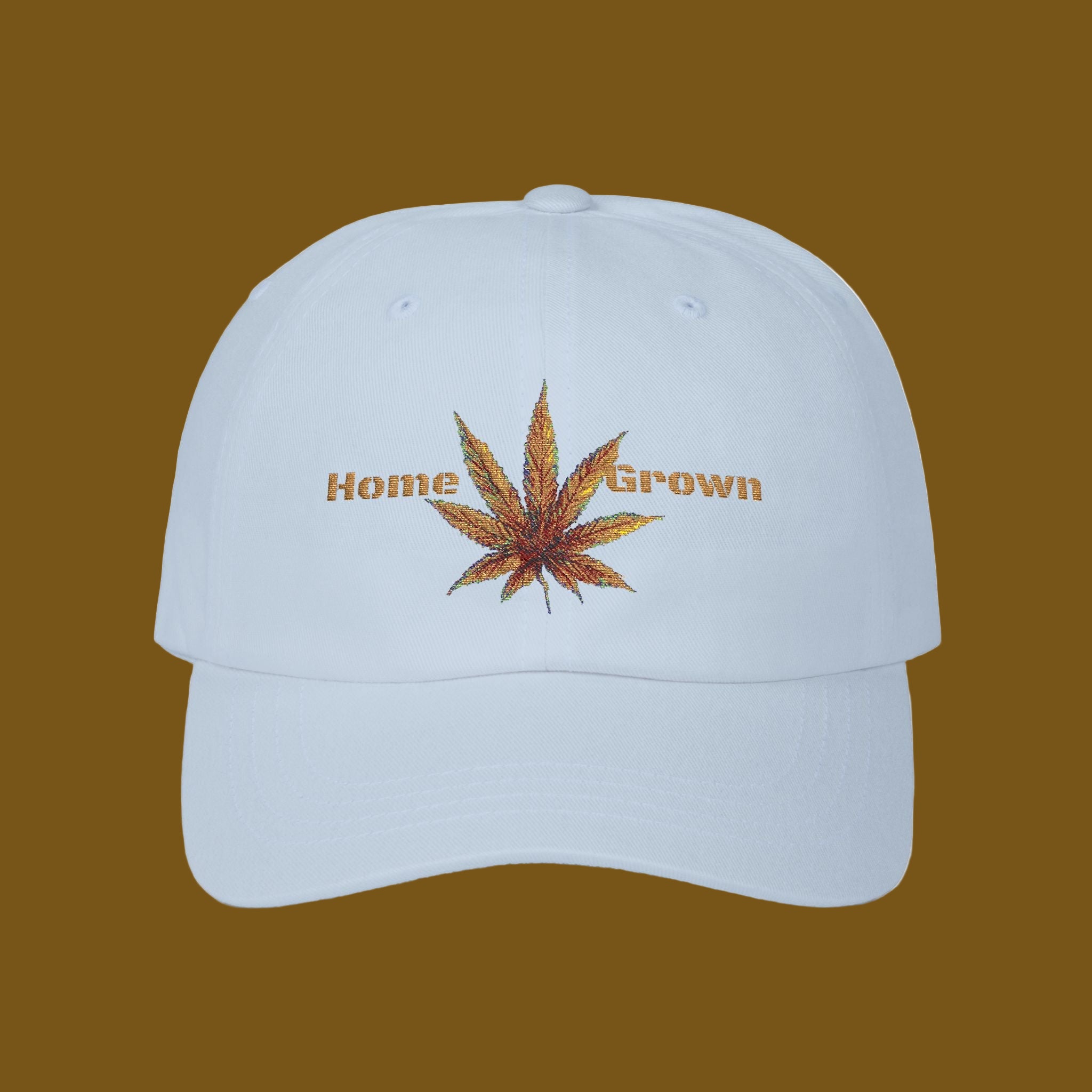 Light blue cap with embroidered cannabis leaf and 'Home Grown' text on a brown background