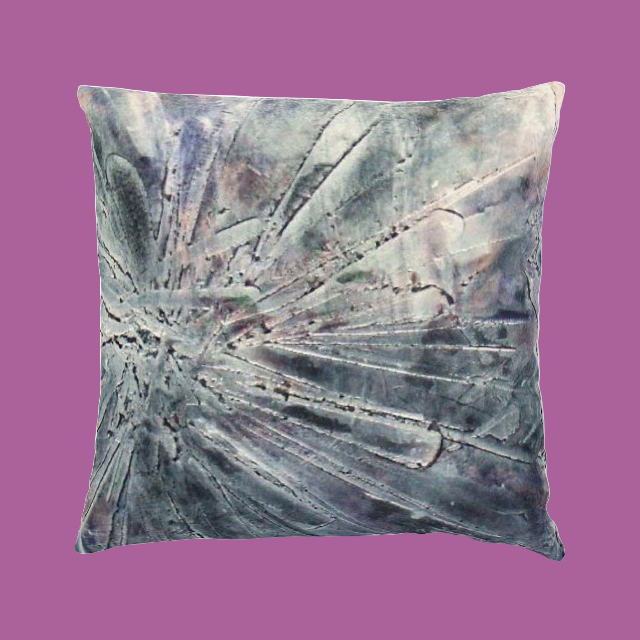 Decorative pillow with abstract pattern on a pink background