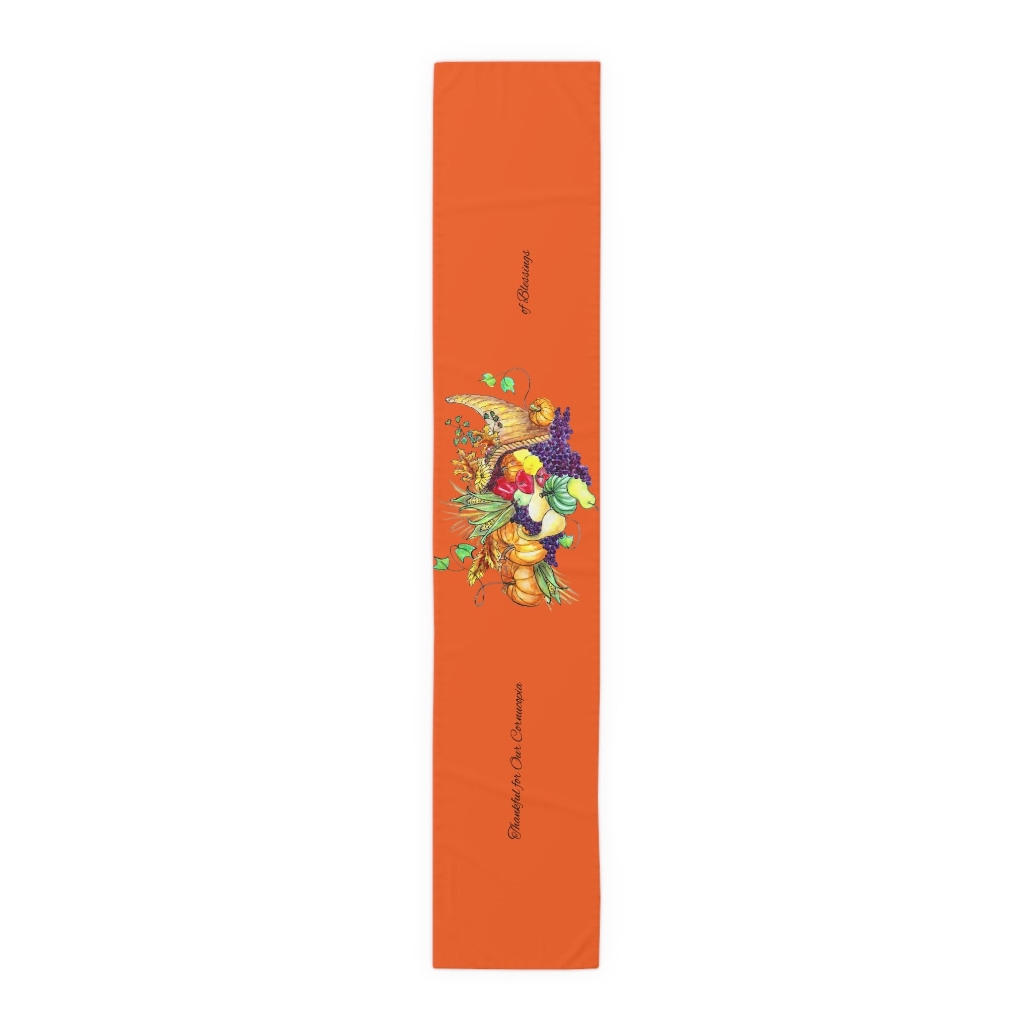 Orange table runner with a cornucopia design on a white background