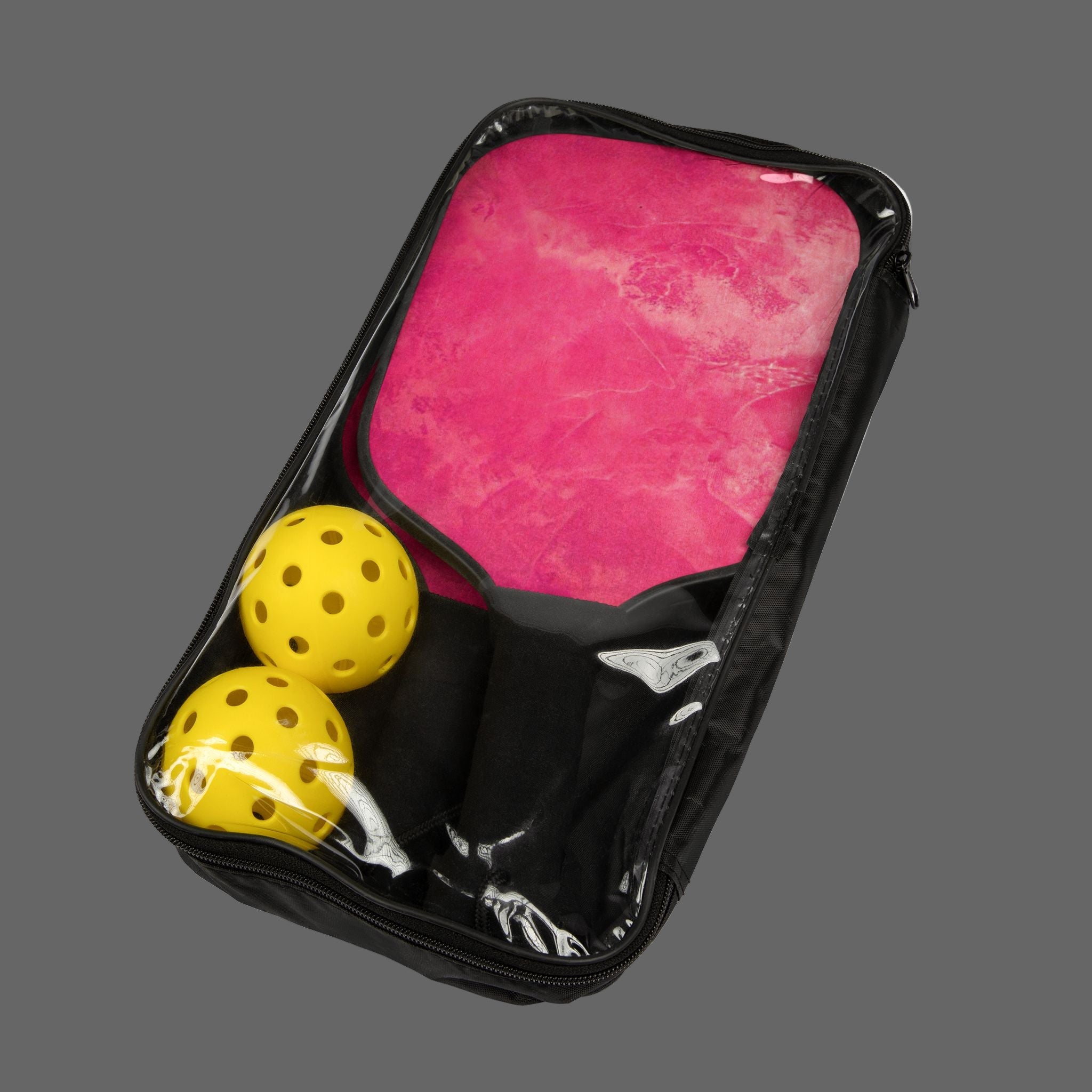 Black carrying case with pink interior and yellow pickle balls on a dark gray background