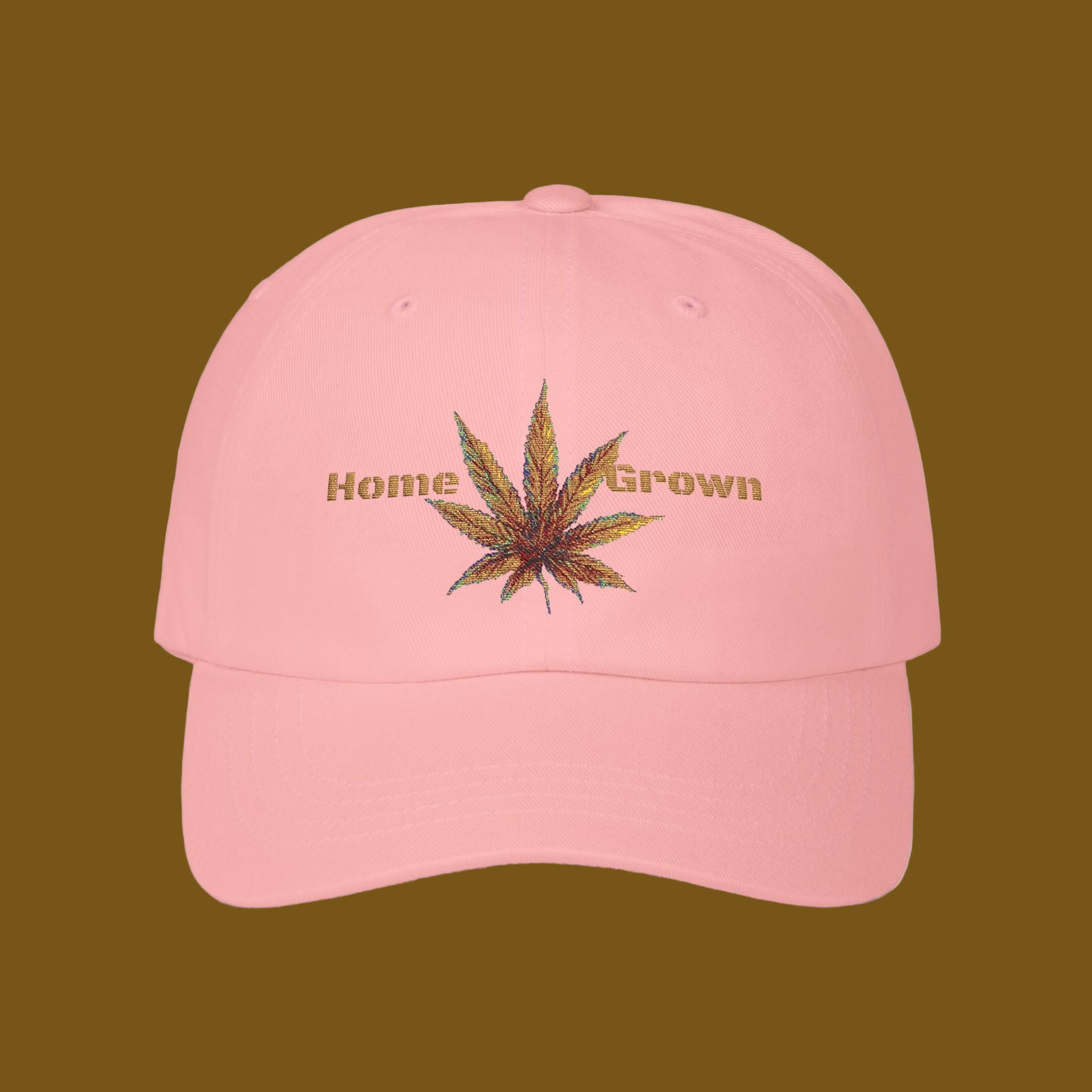 Pink cap with cannabis leaf and 'Home Grown' text on a brown background