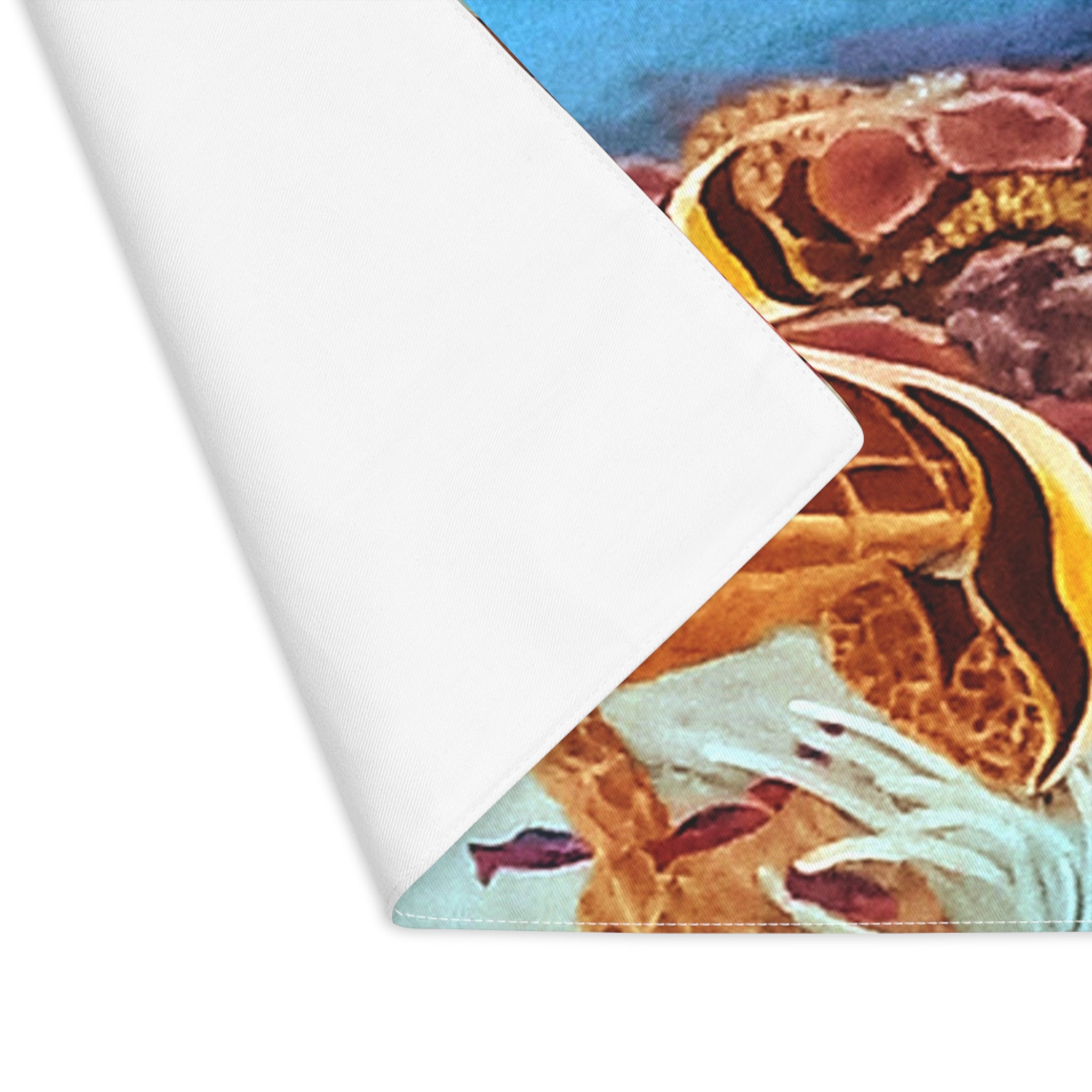 Close-up of a textured surface with a scene of sea turtle and fish, on a white background.