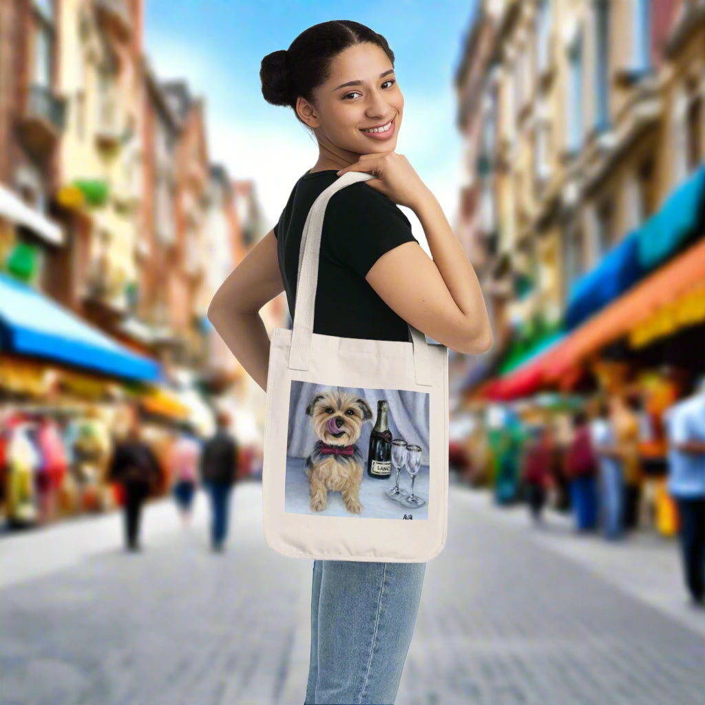 Woman holding a tote bag with a dog and wine design on a white background