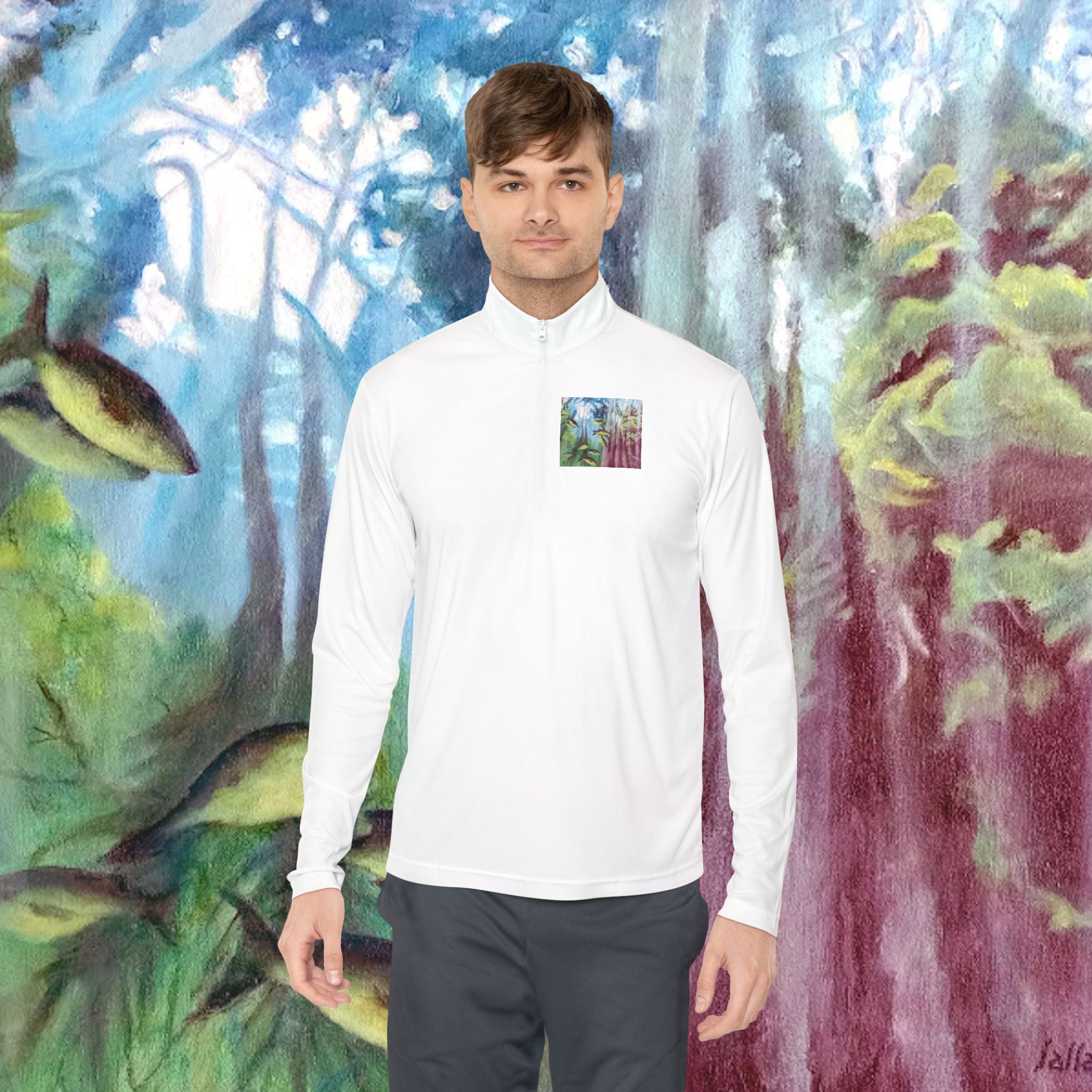 Man wearing a white long-sleeve shirt with a small colorful square on a painted background