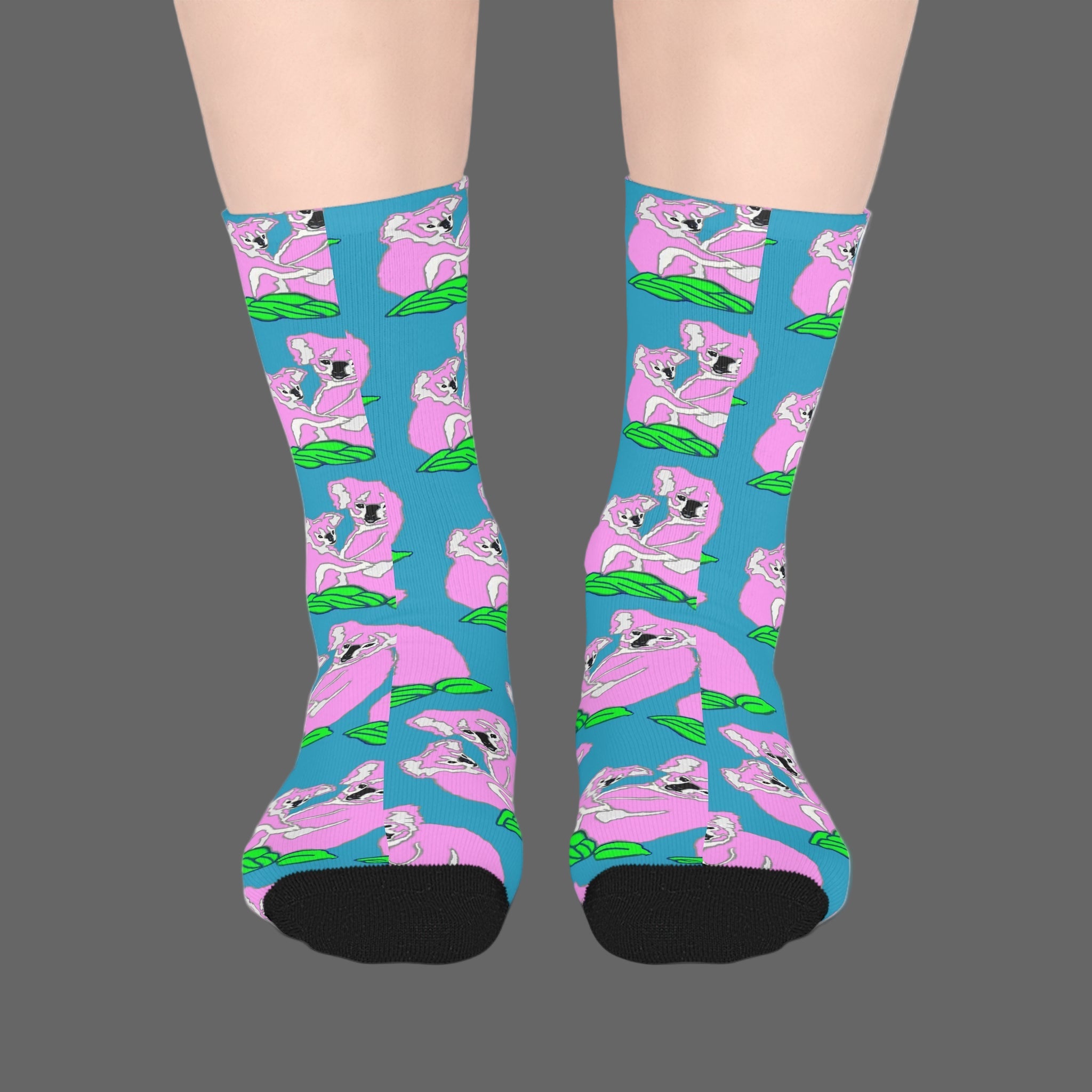 Socks with pink koala design on a blue background