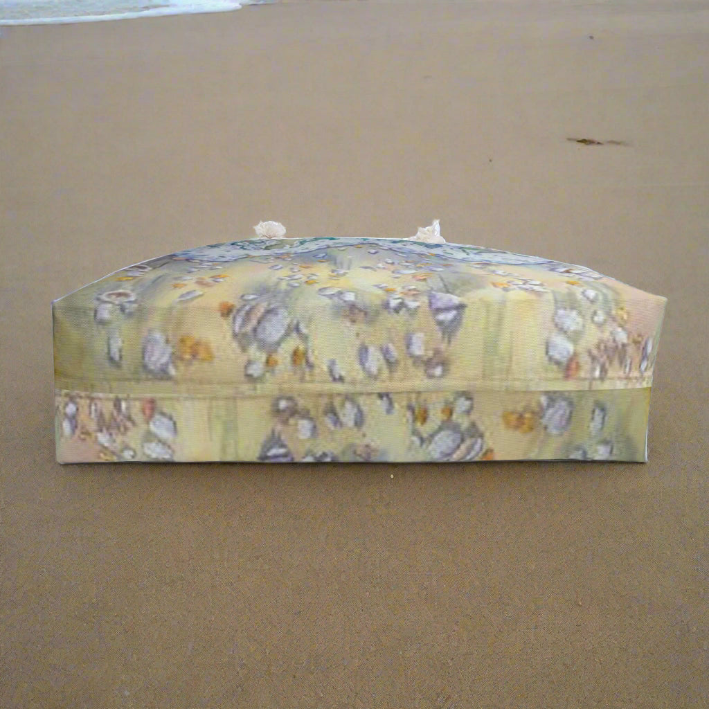bottom of tote bag showing sea shells on the beach