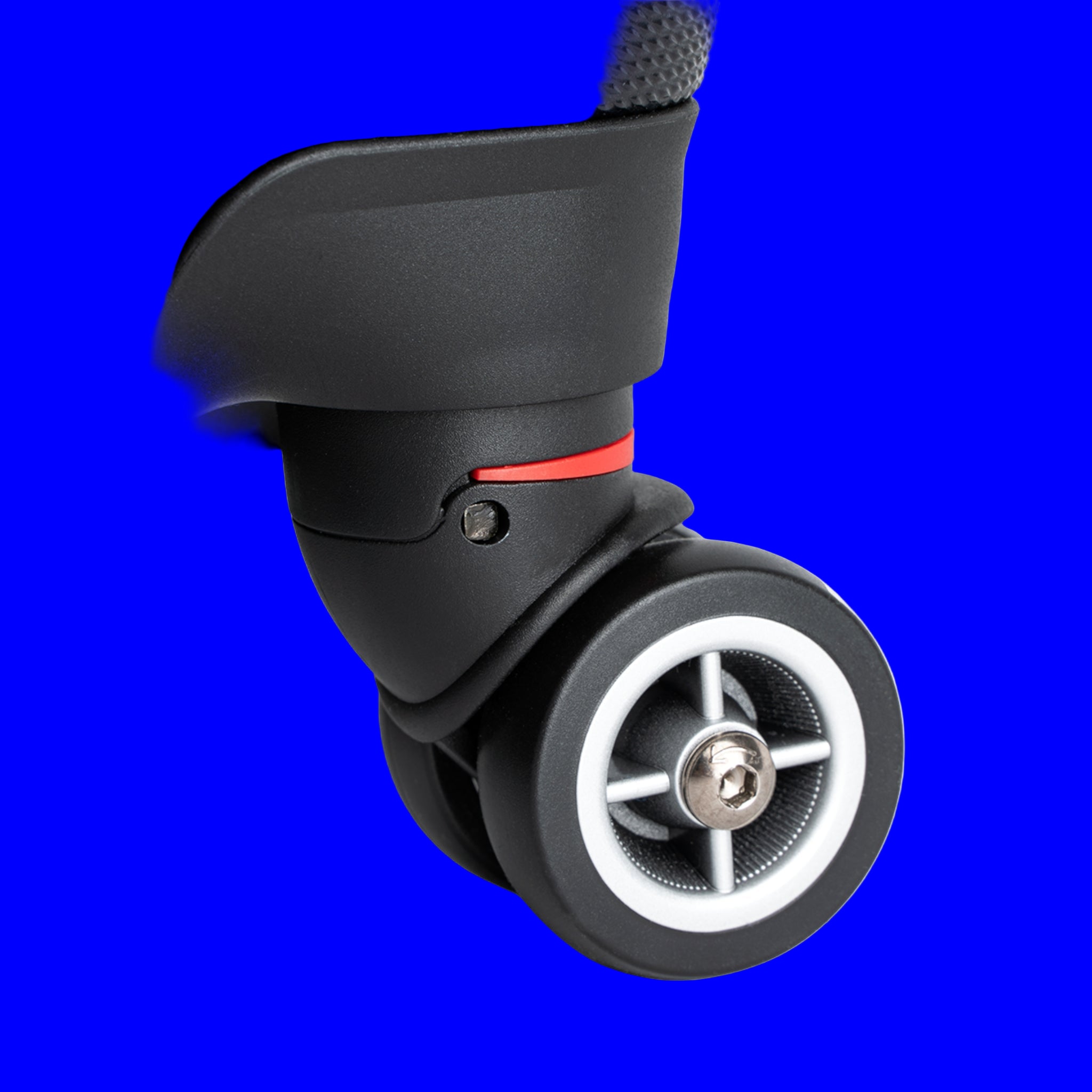 Close-up of a suitcase wheel on a blue background