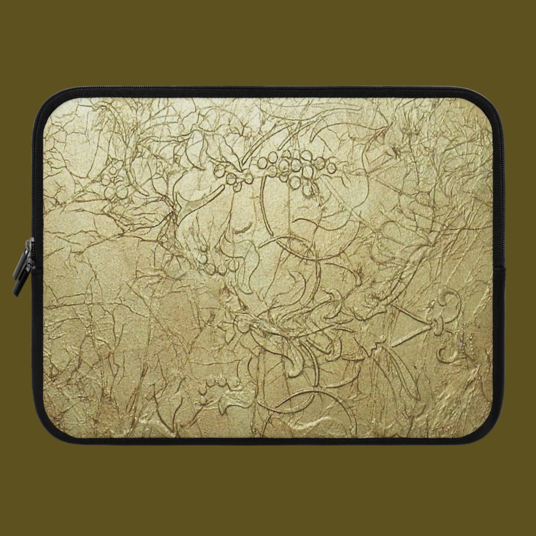 Laptop sleeve with intricate leaf pattern on a beige background