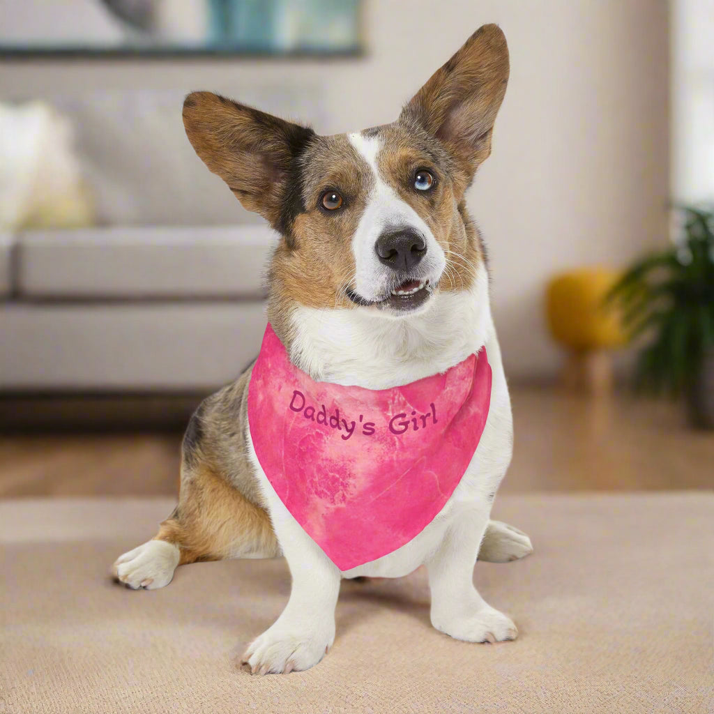 Dog wearing a pink 'Daddy's Girl' bandana in a living room