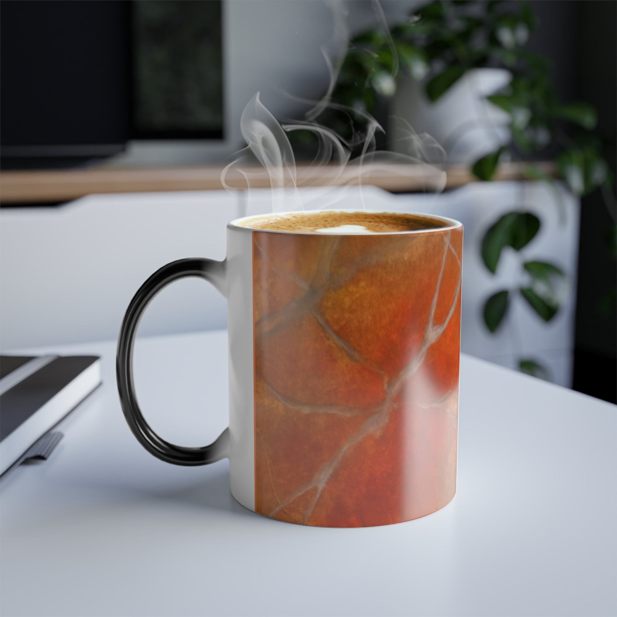 Marbled mug designed by Studio Blitz with steam on a desk in an office setting