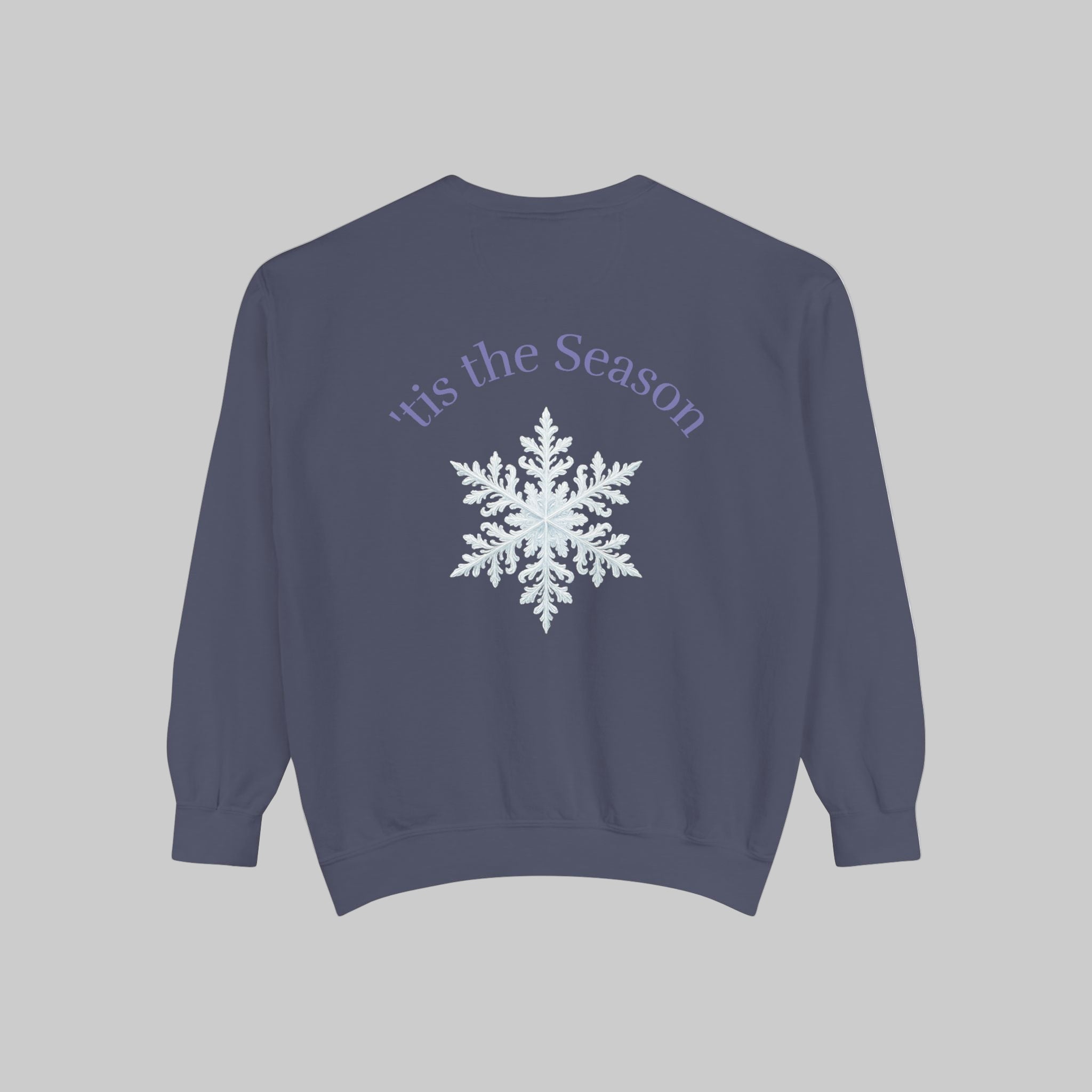 Dark blue sweatshirt with 'tis the Season and snowflake design on a light background