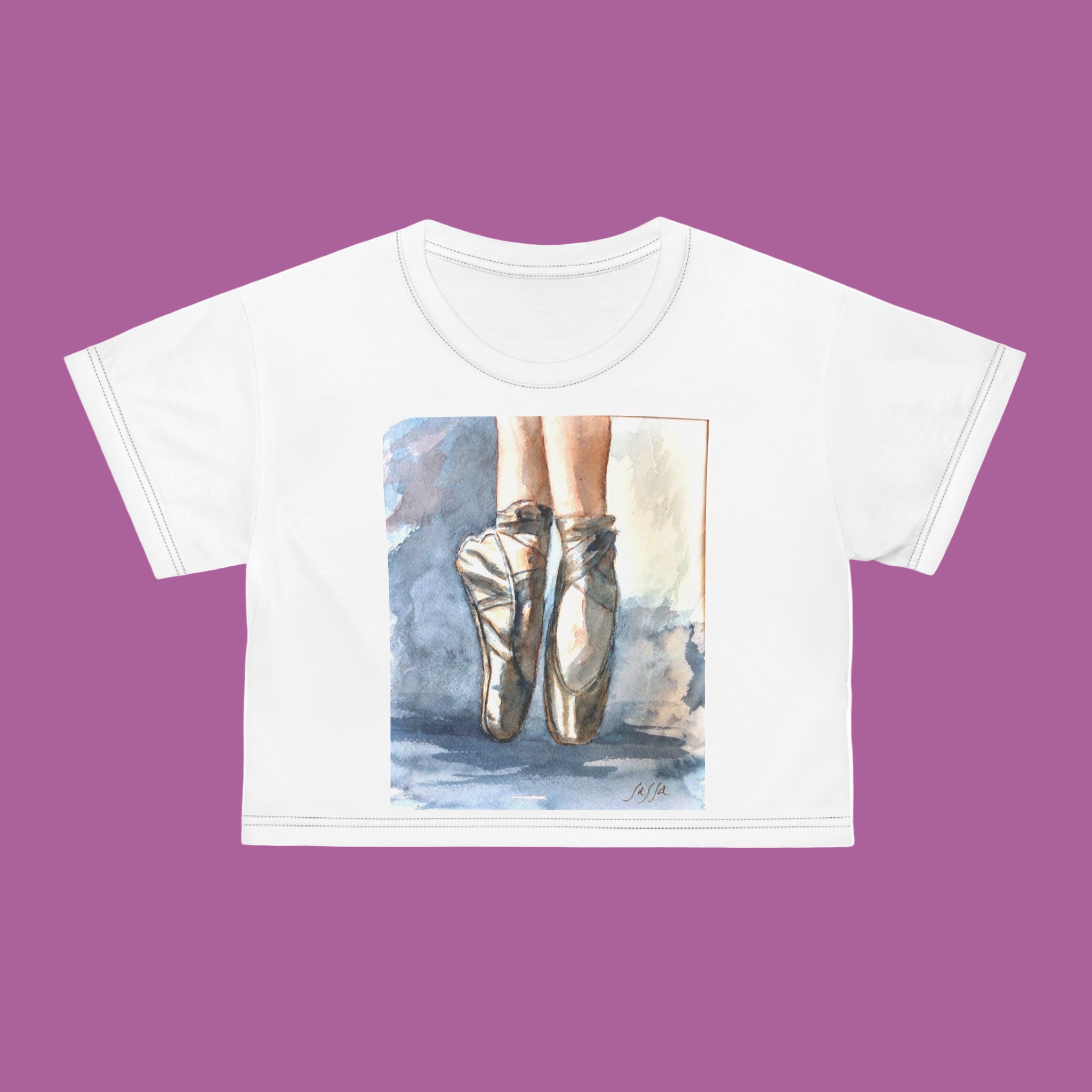 White crop top with a graphic of ballet shoes on a blue background