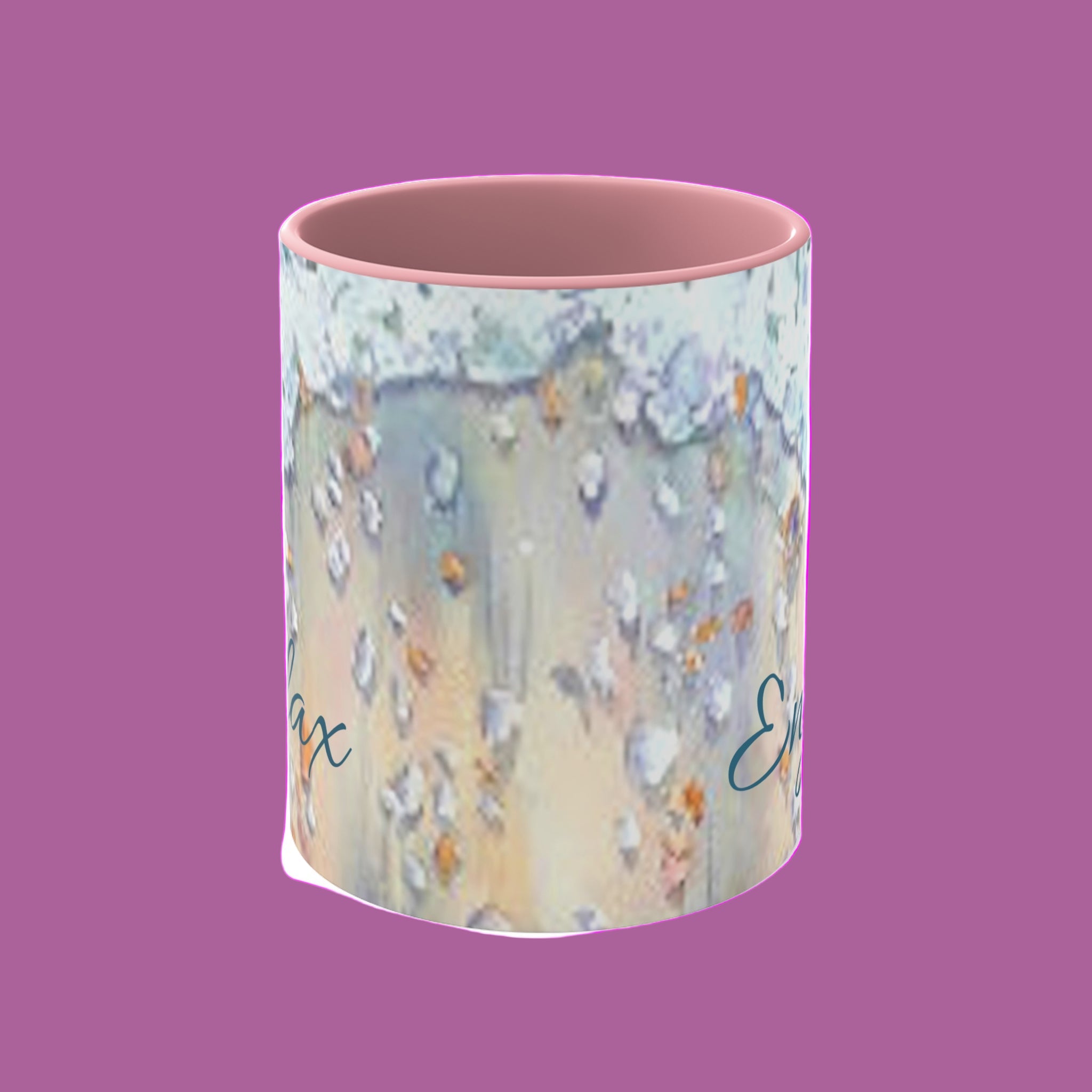 Mug with colorful design and text on a pink  background