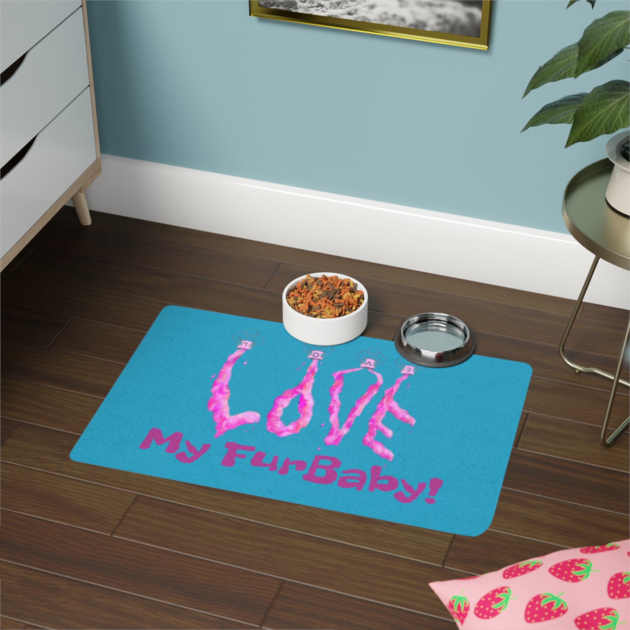 Pet mat with 'Love My FurBaby!' text on a wooden floor with a bowl of food and water dish.