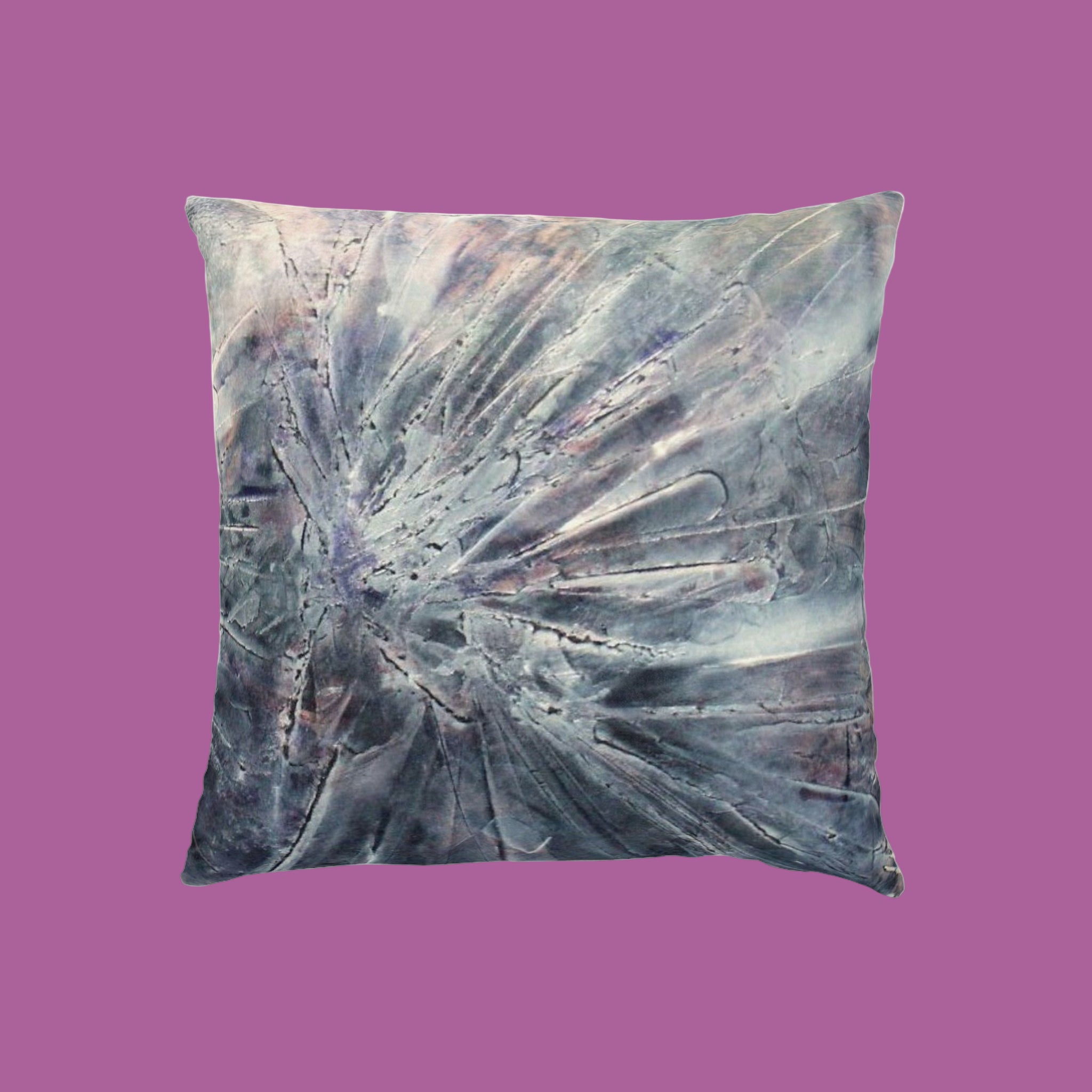 Decorative pillow with abstract pattern on a pink background