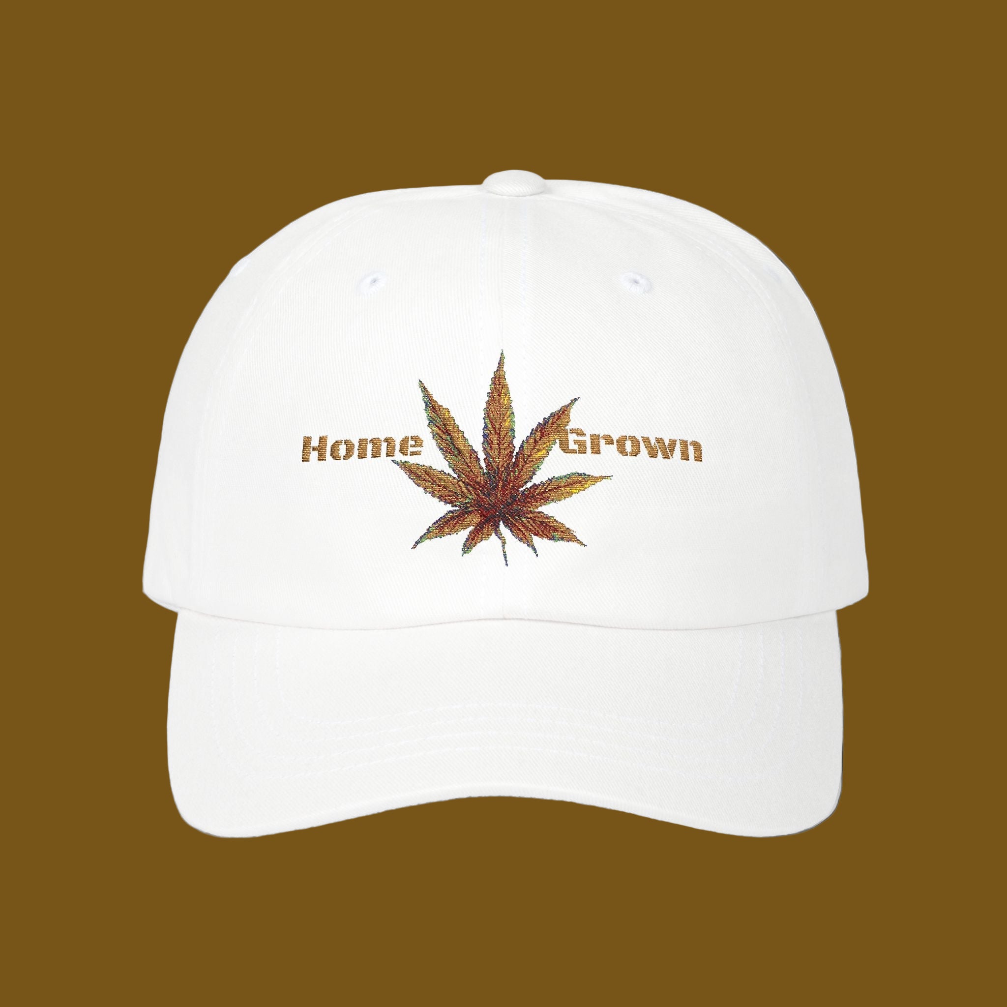 White cap with a cannabis leaf and 'Home Grown' text on a brown background