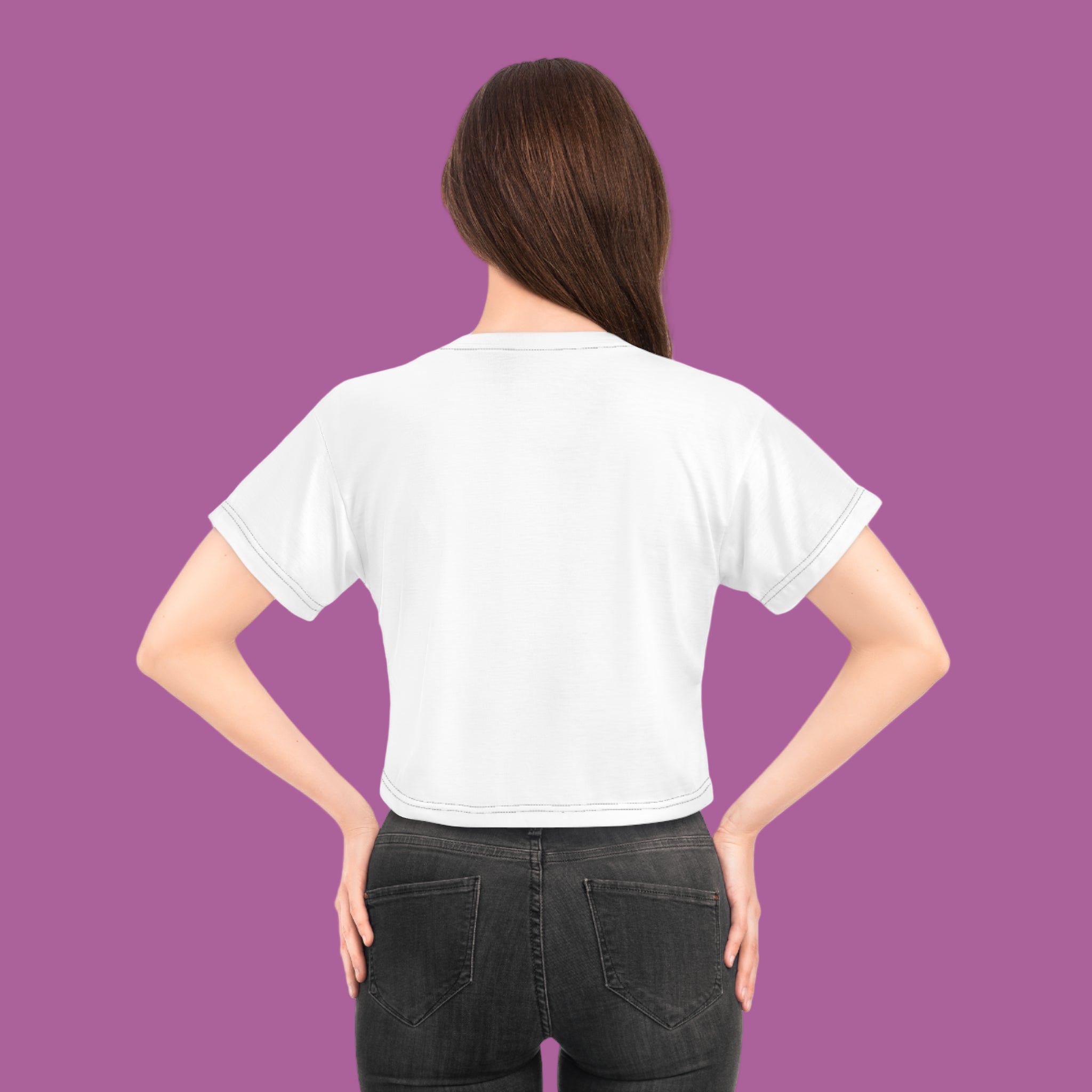 Person wearing a plain white t-shirt on a pink background