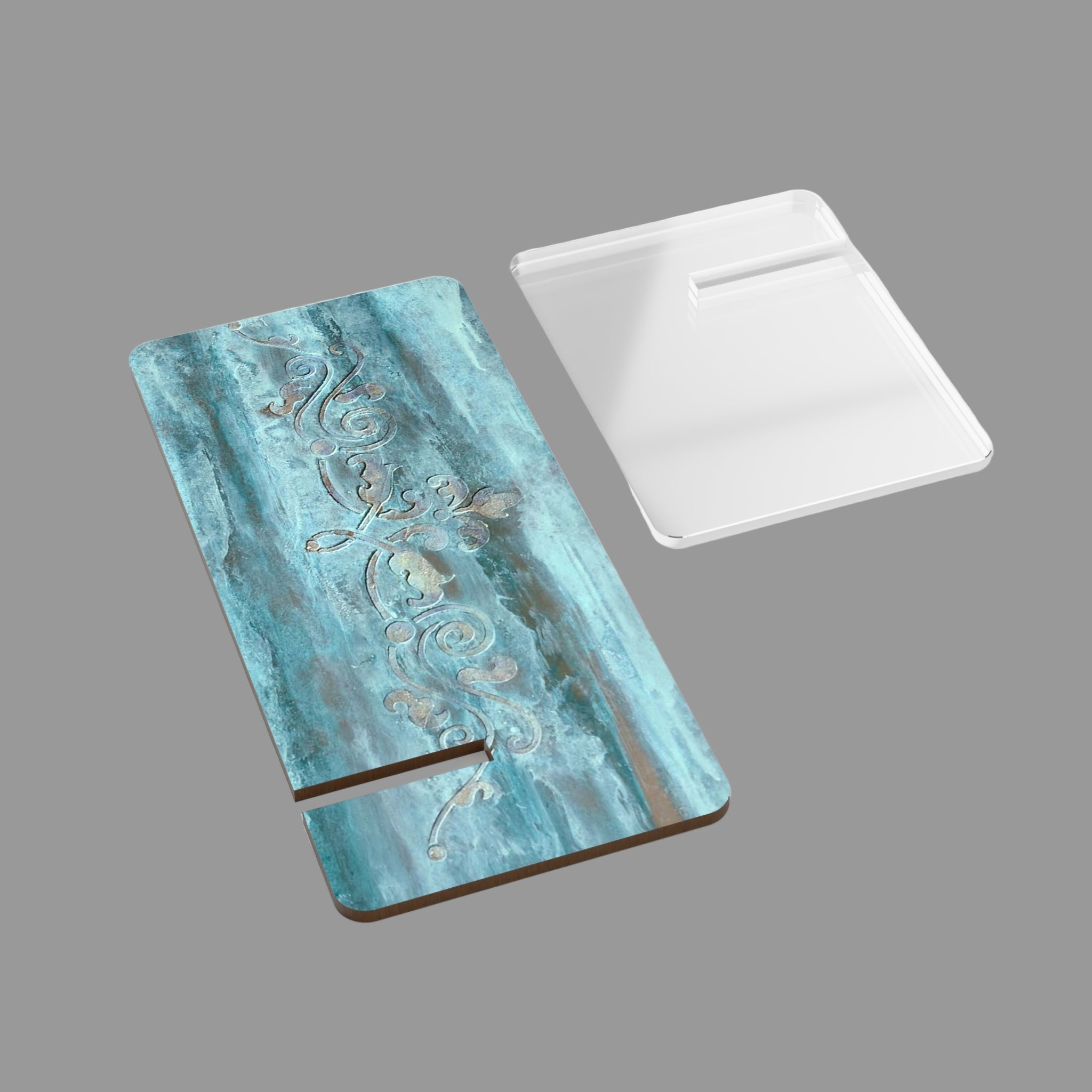 Decorative smart phone stand with scroll  pattern on a light background