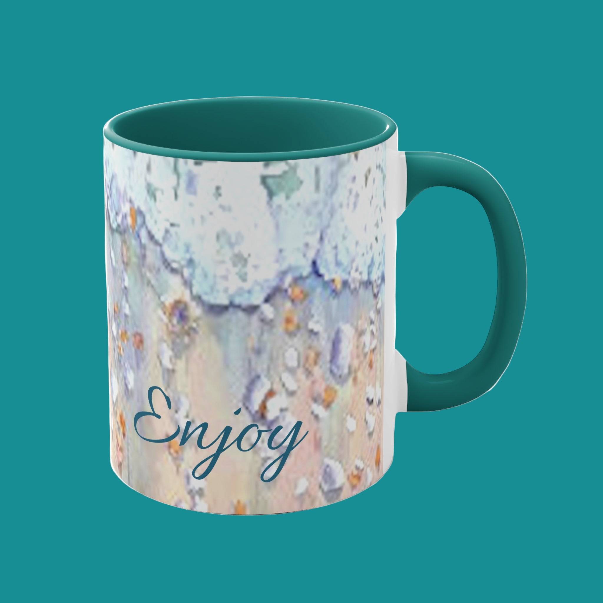 Mug with beach foam and shells pattern and 'Enjoy' text on a teal  background