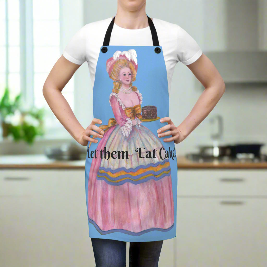Person wearing a colorful apron with a design and text 'Let them Eat Cake' on a white background