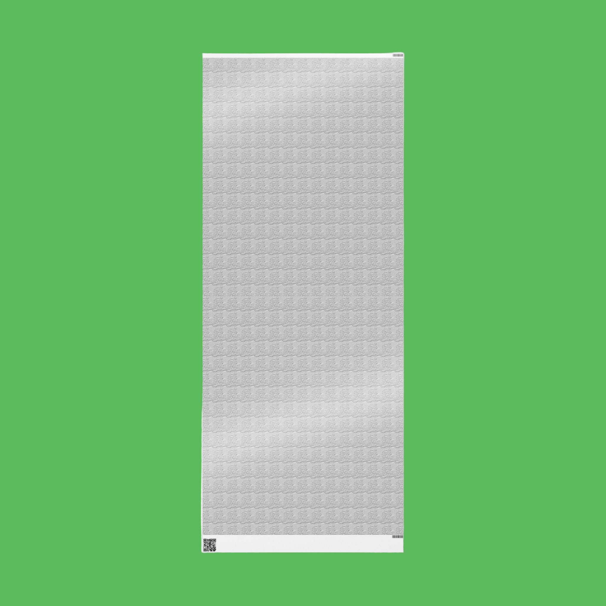 White textured wrapping paper on a green background