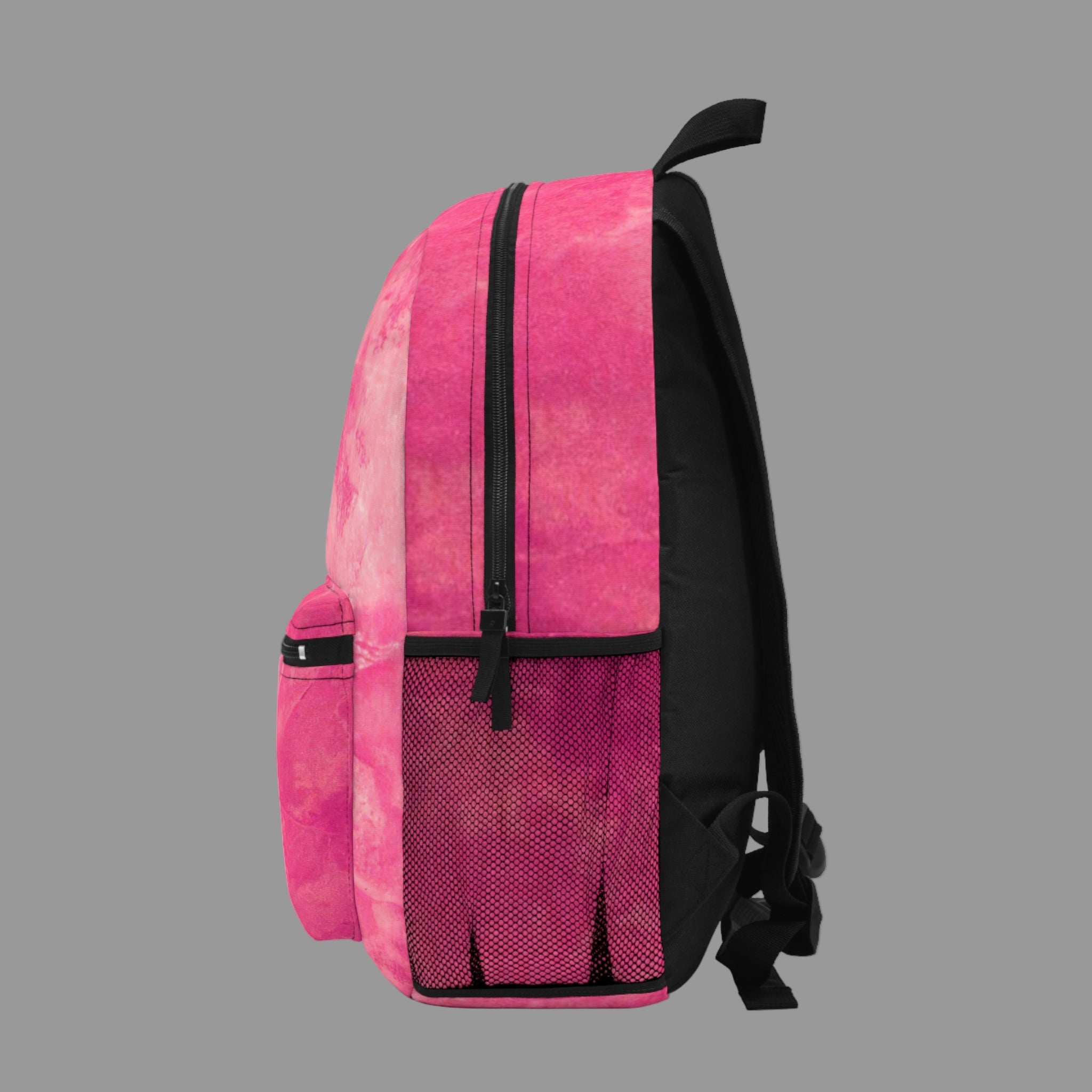 Pink and black backpack on a light gray background