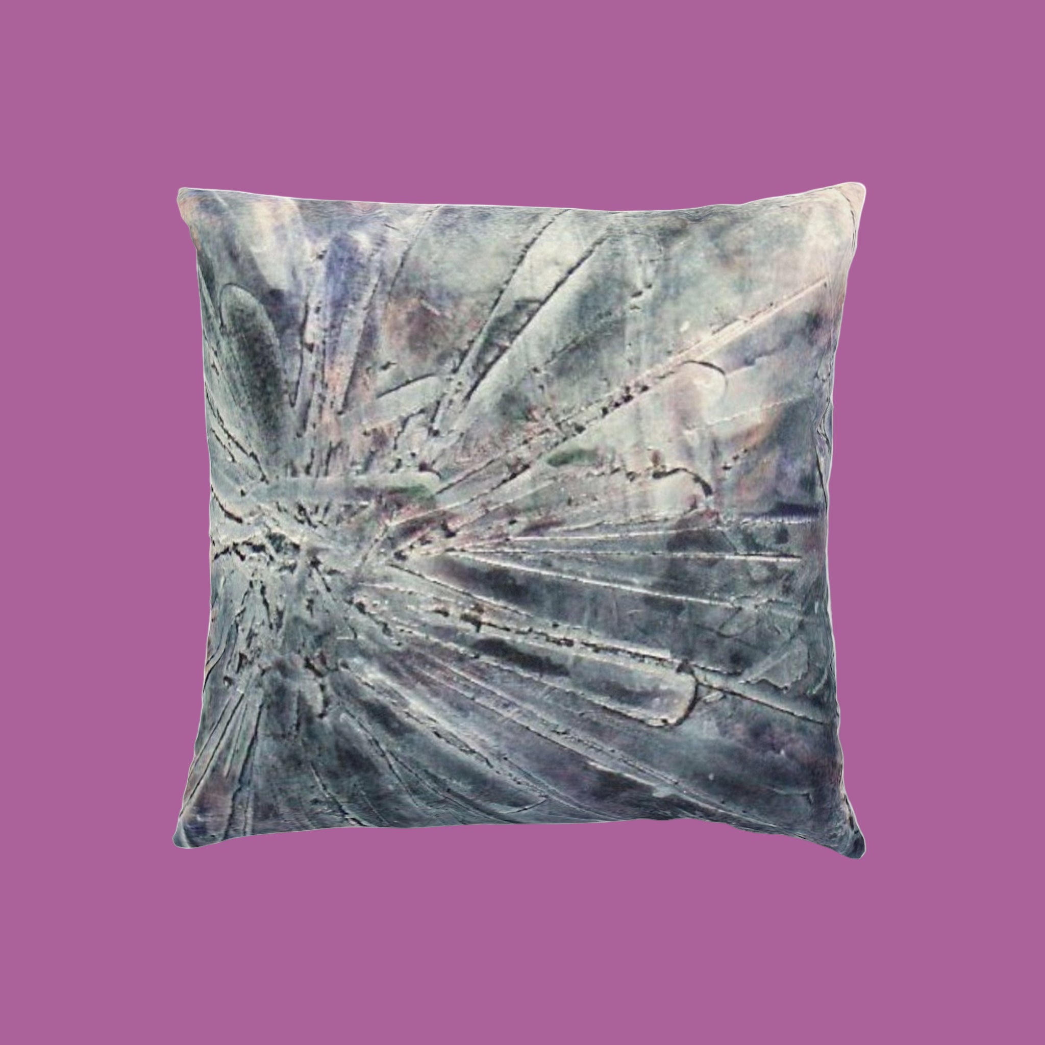 Decorative pillow with abstract pattern on a pink background