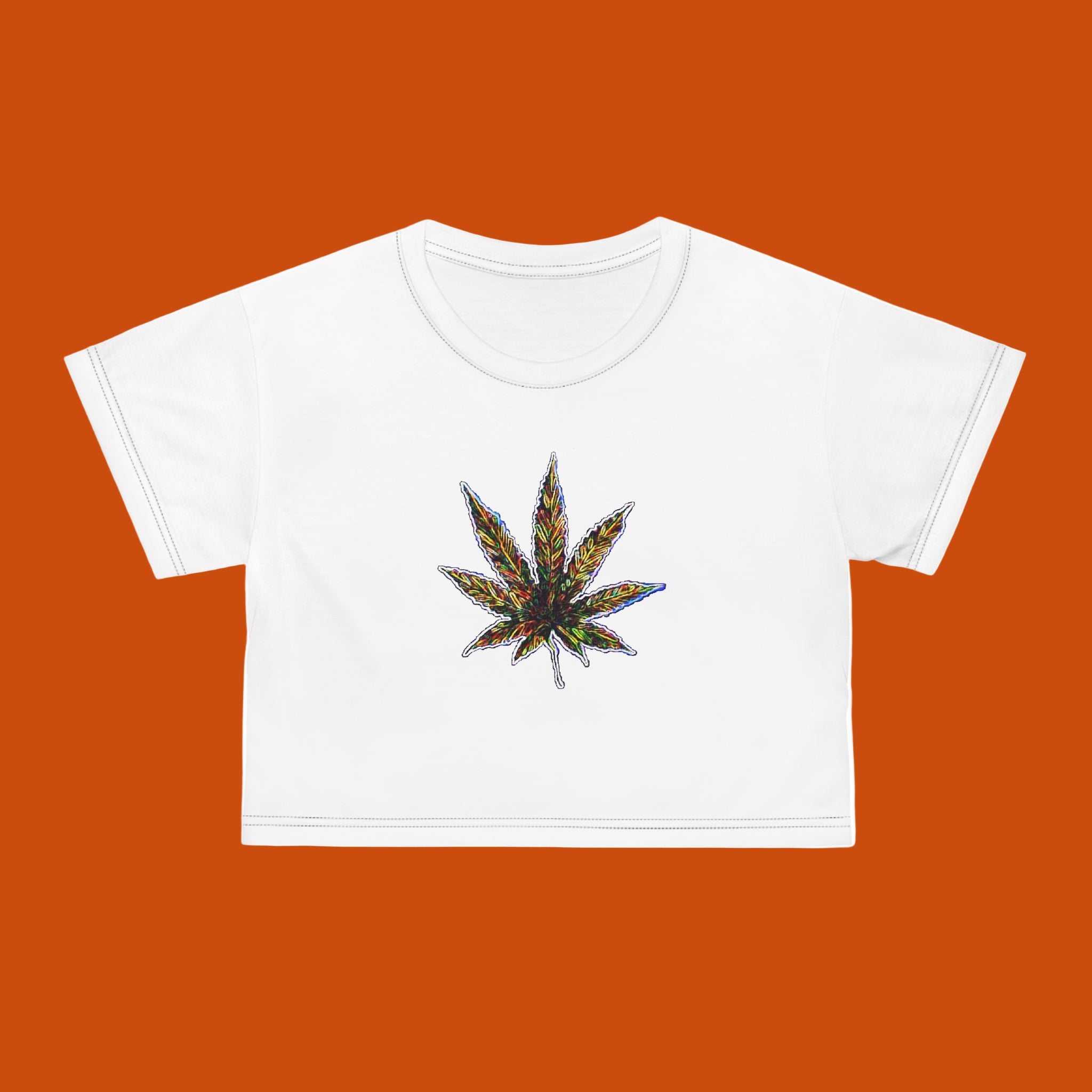 White crop top with a colorful cannabis leaf design on a white background
