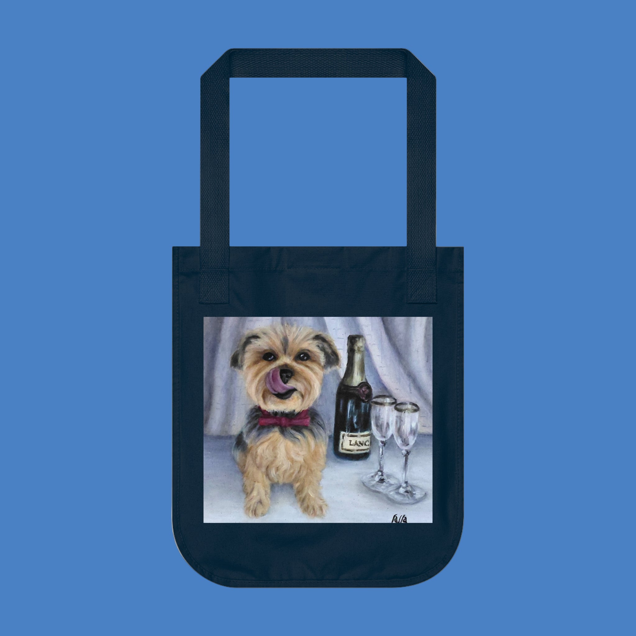 Navy tote bag with a dog and champagne design on a blue background