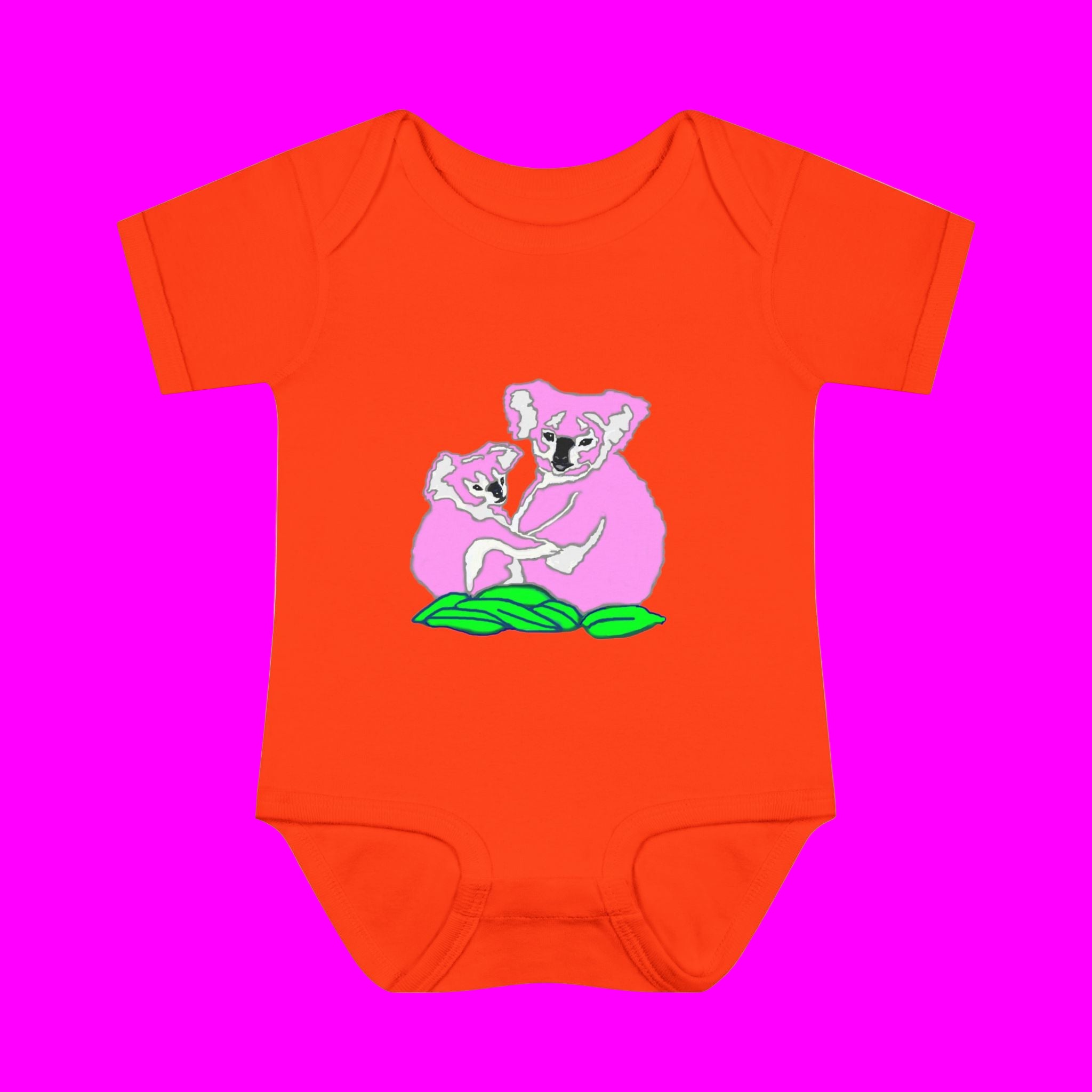 Orange baby onesie with koala design on a white background