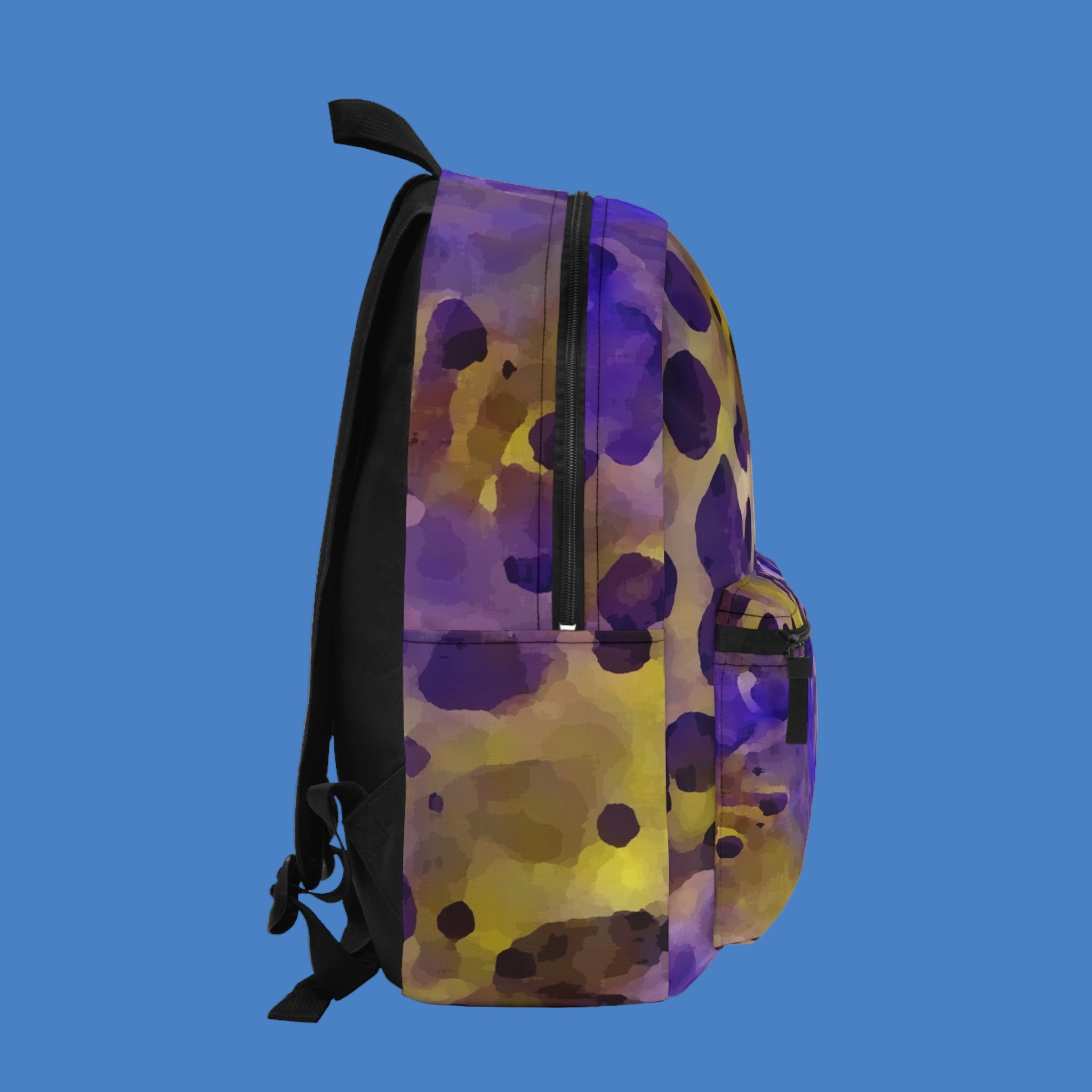Backpack with purple and yellow abstract pattern on a white background
