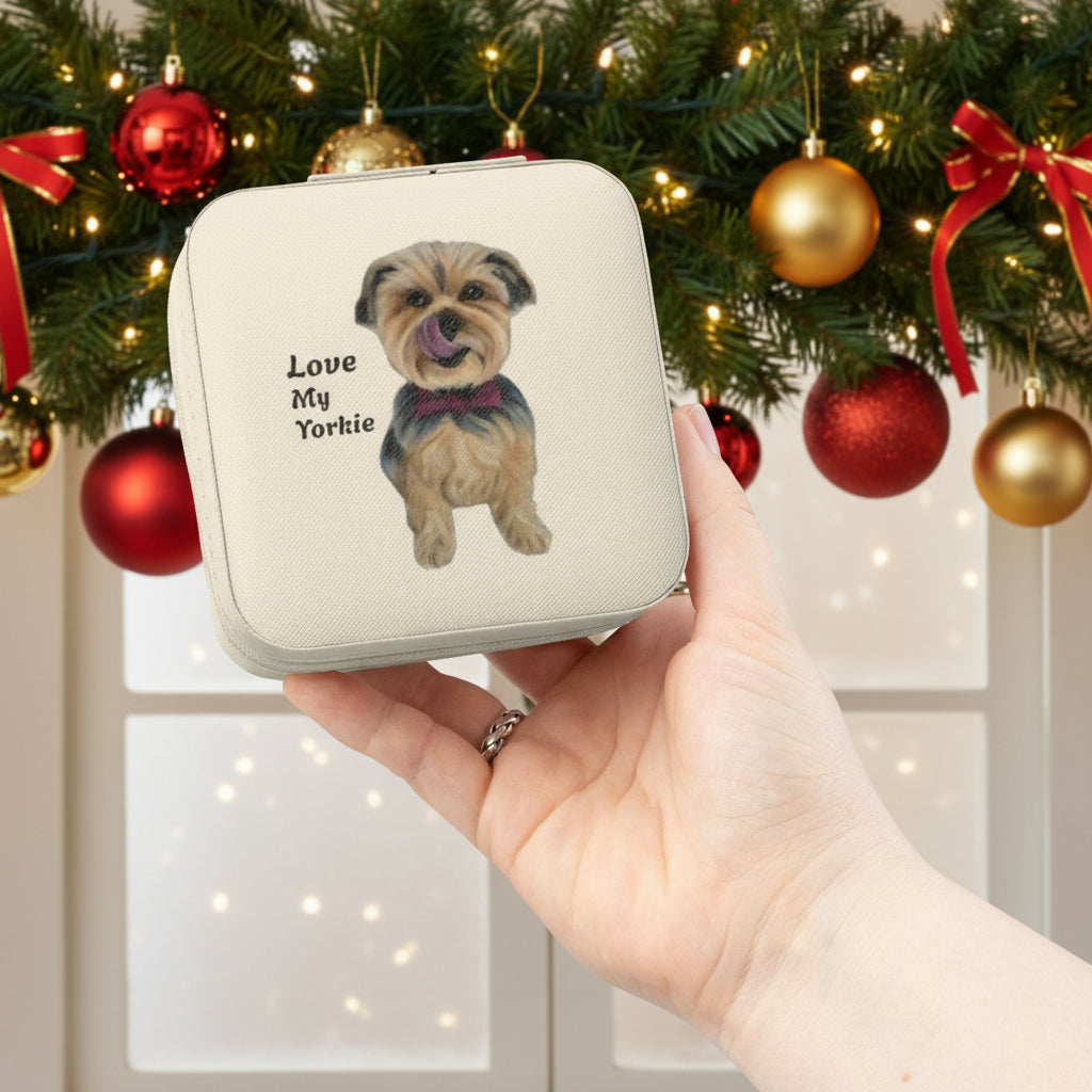 Yorkie painted travel jewelry case being held in front of Christmas decor