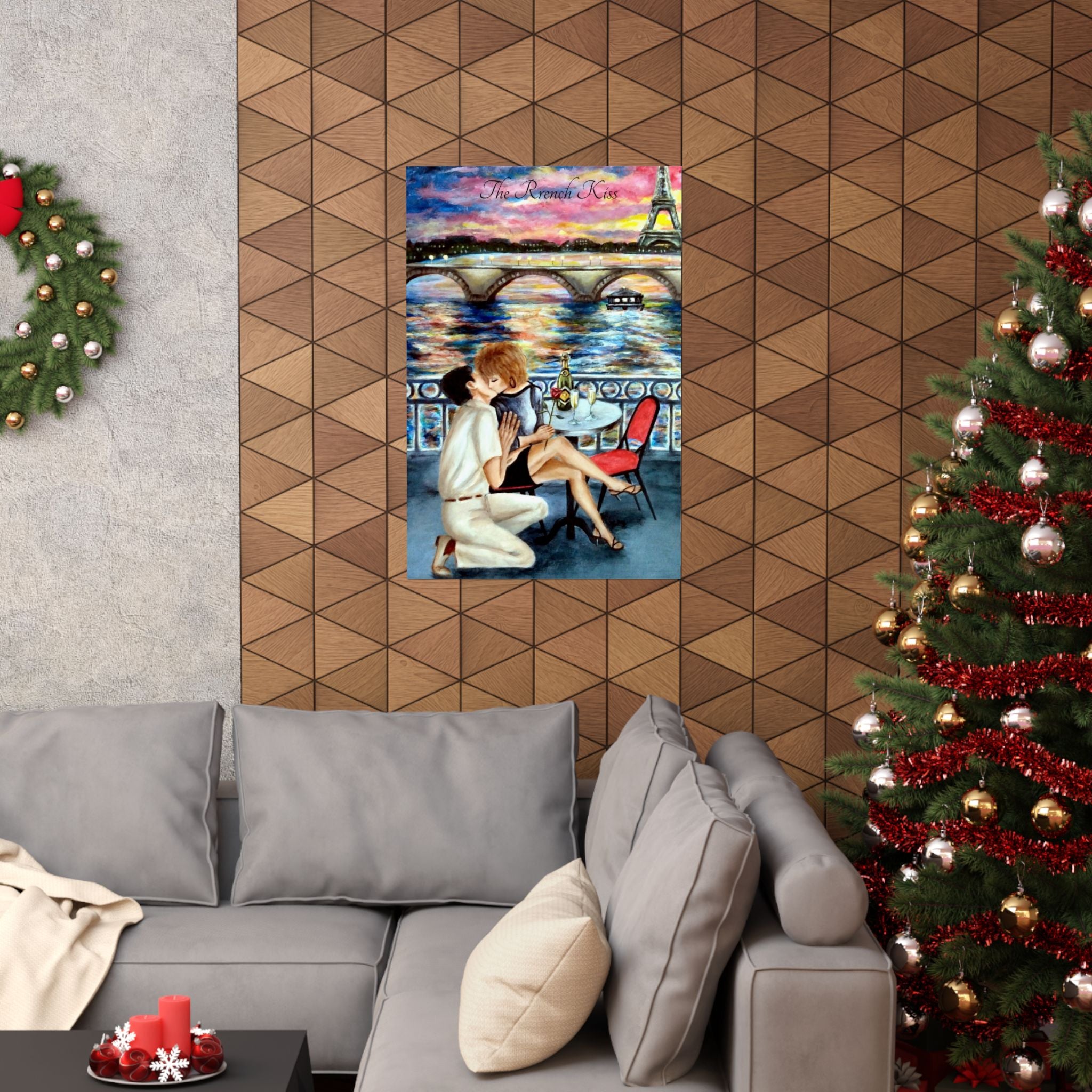Decorative painting of a couple in a romantic setting on a wall above a gray sofa with a Christmas tree to the right.