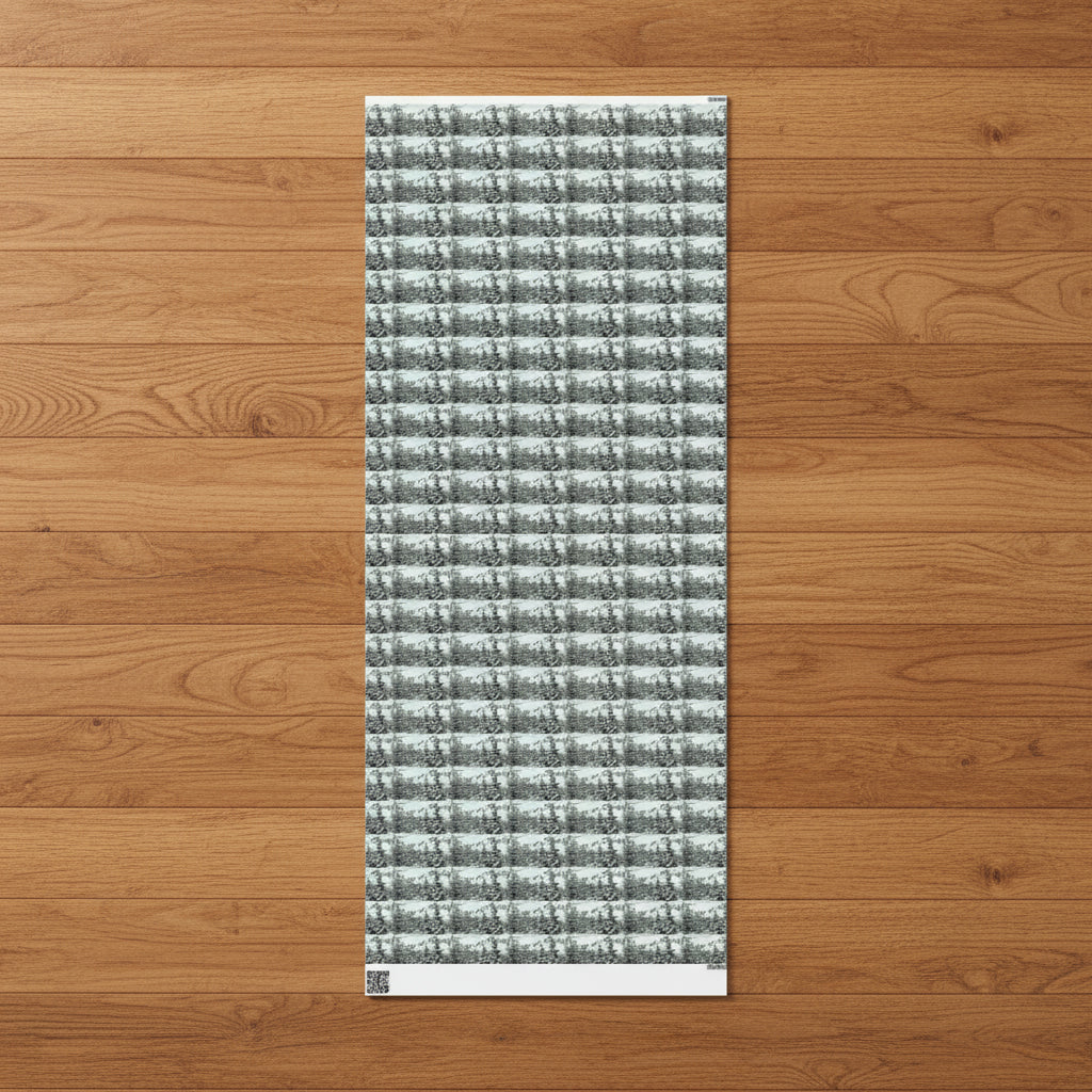 Textured rectangular sheet of wrapping paper with a snowy pine tree pattern on a wooden floor