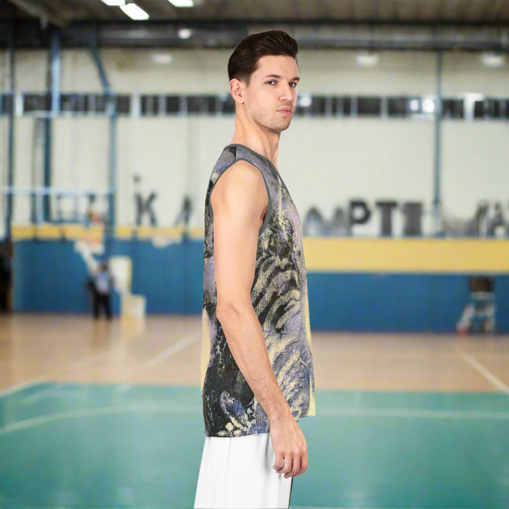 Man wearing a sleeveless, jungle patterned shirt on a white background
