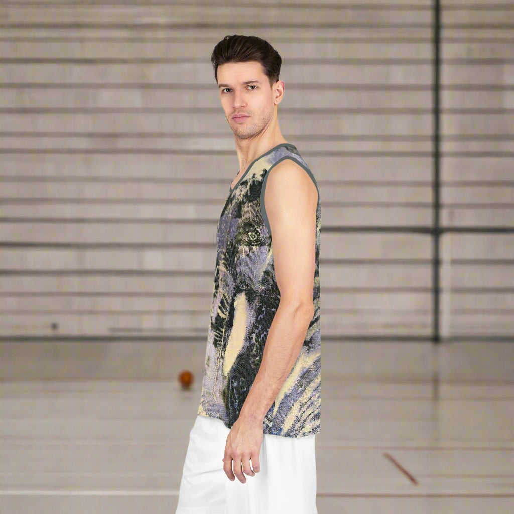 Man wearing a sleeveless, jungle patterned shirt on a basketball court background