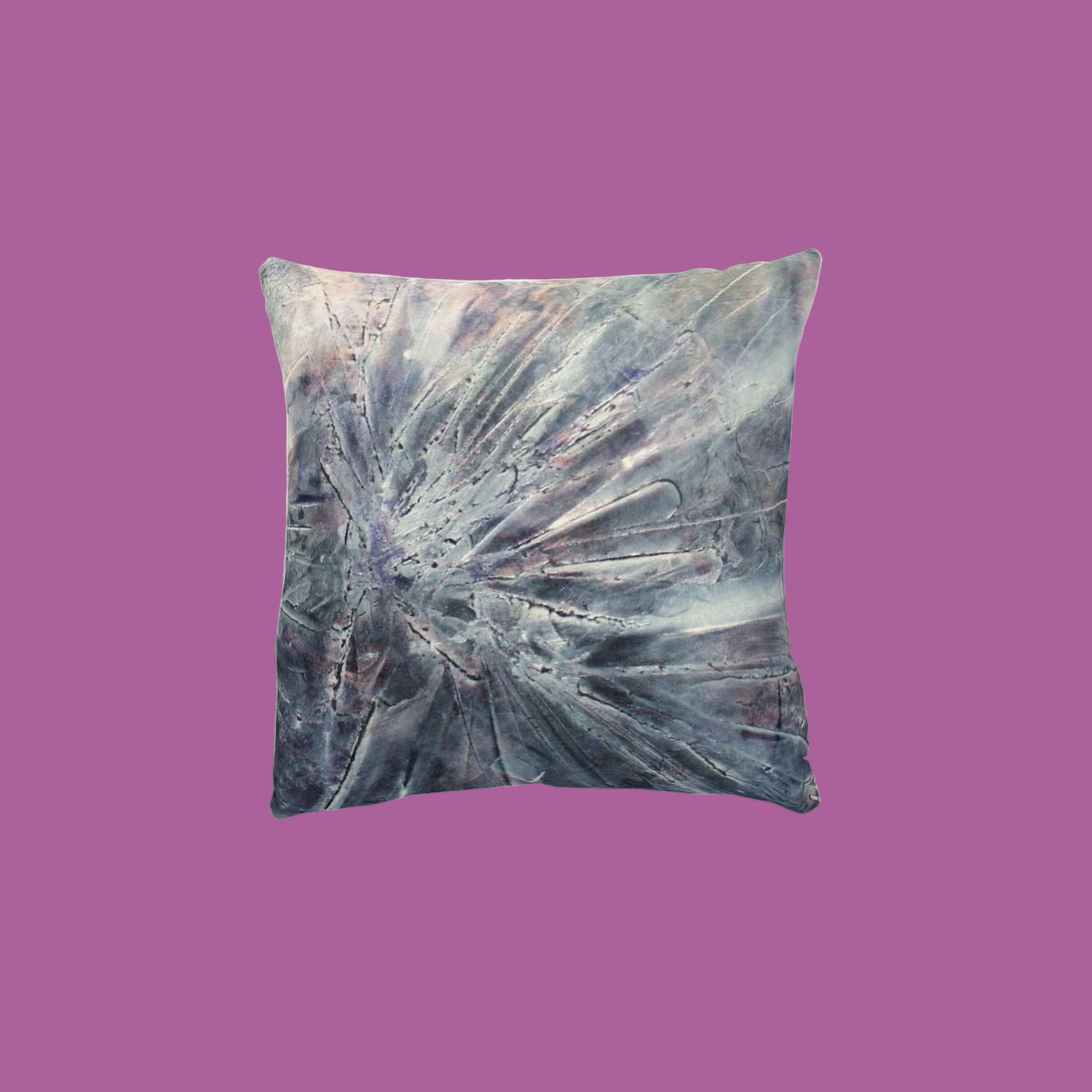 Decorative pillow with abstract design on a pink background