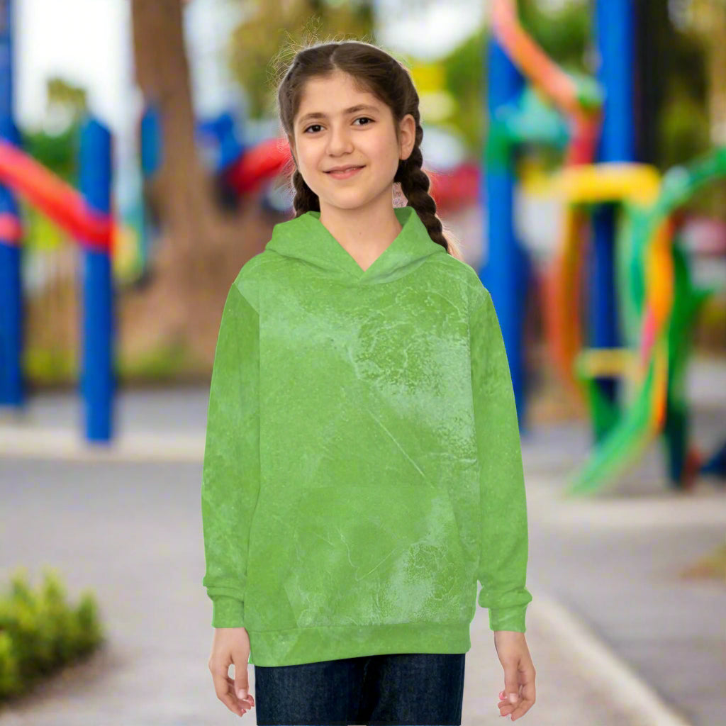 Girl wearing a green hoodie n a school background